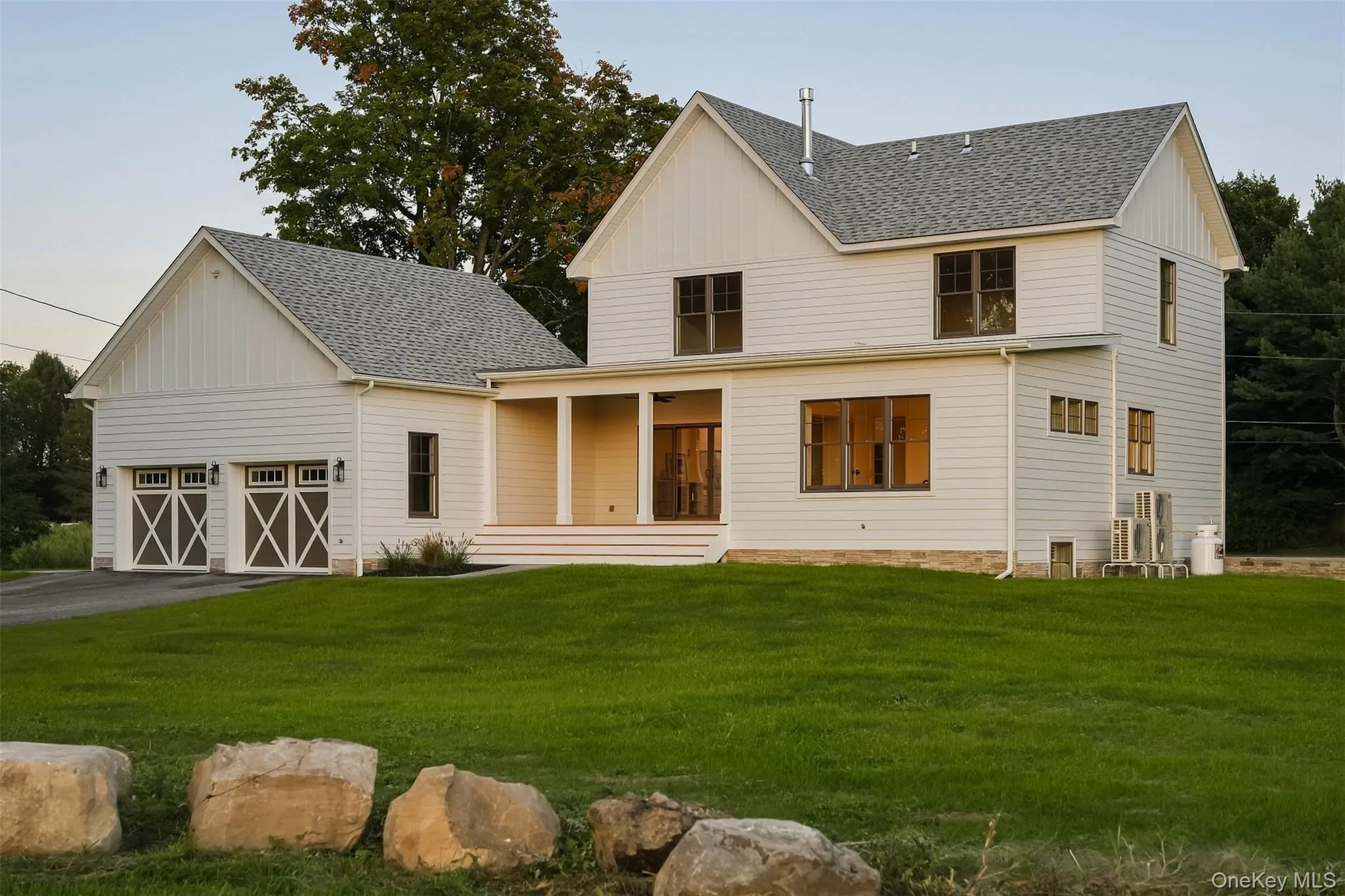 Barn style garage doors, bluestone paver walkways in the back and side of the home. The back of the home is just as pretty, Barn style garage doors, bluestone paver walkways in the back and side of the home. The back of the home is just as pretty,
