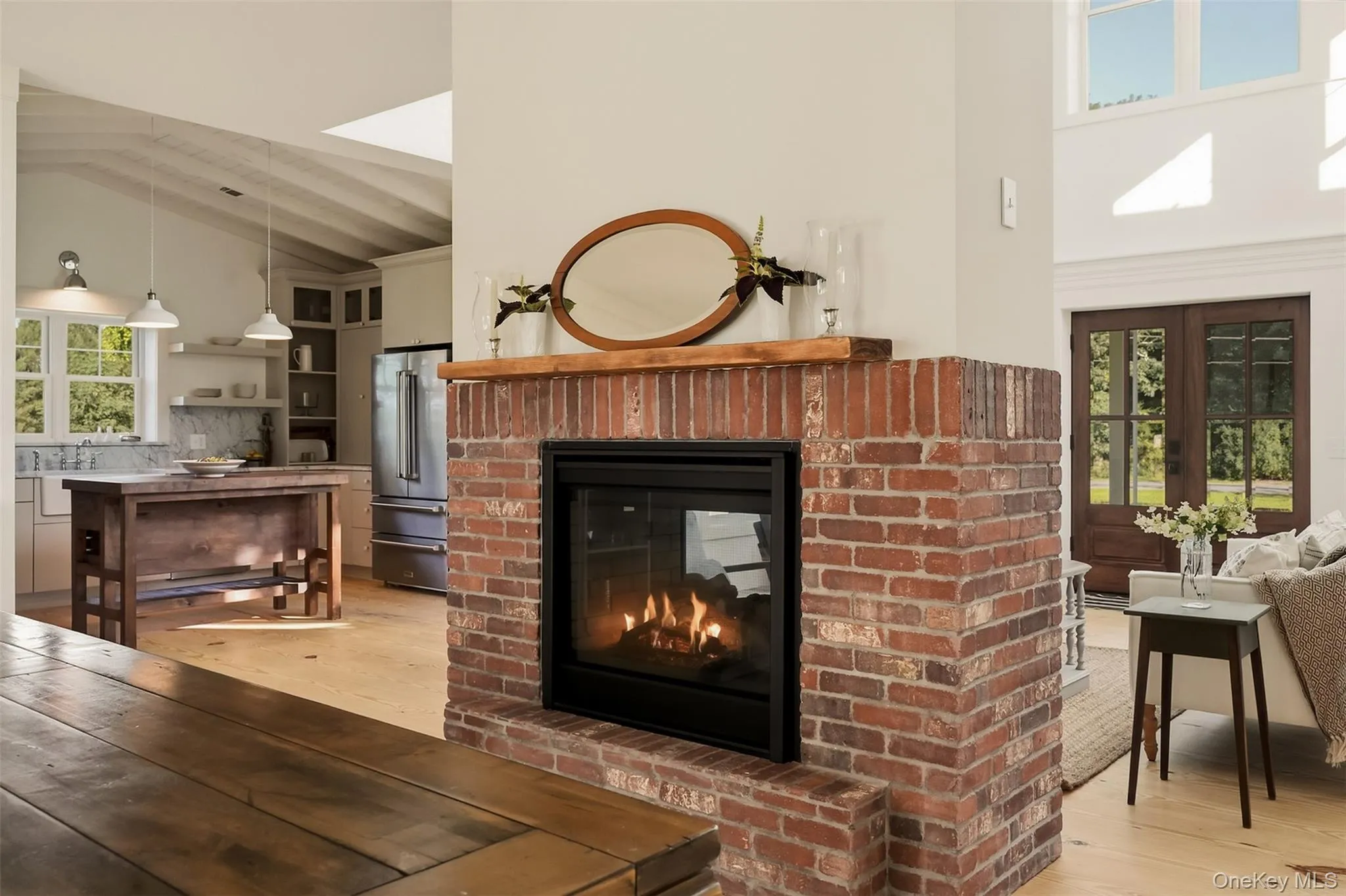 The double sided brick fireplace is the focal point of the home and is the heart of the home, allowing great flow between living spaces The double sided brick fireplace is the focal point of the home and is the heart of the home, allowing great flow between living spaces