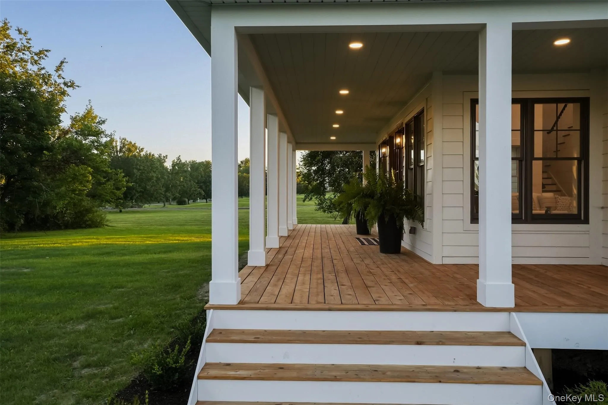 Welcome to your timeless cedar wrap around front porch overlooking your lush green front yard. The perfect place for your rocking chairs. Welcome to your timeless cedar wrap around front porch overlooking your lush green front yard. The perfect place for your rocking chairs.