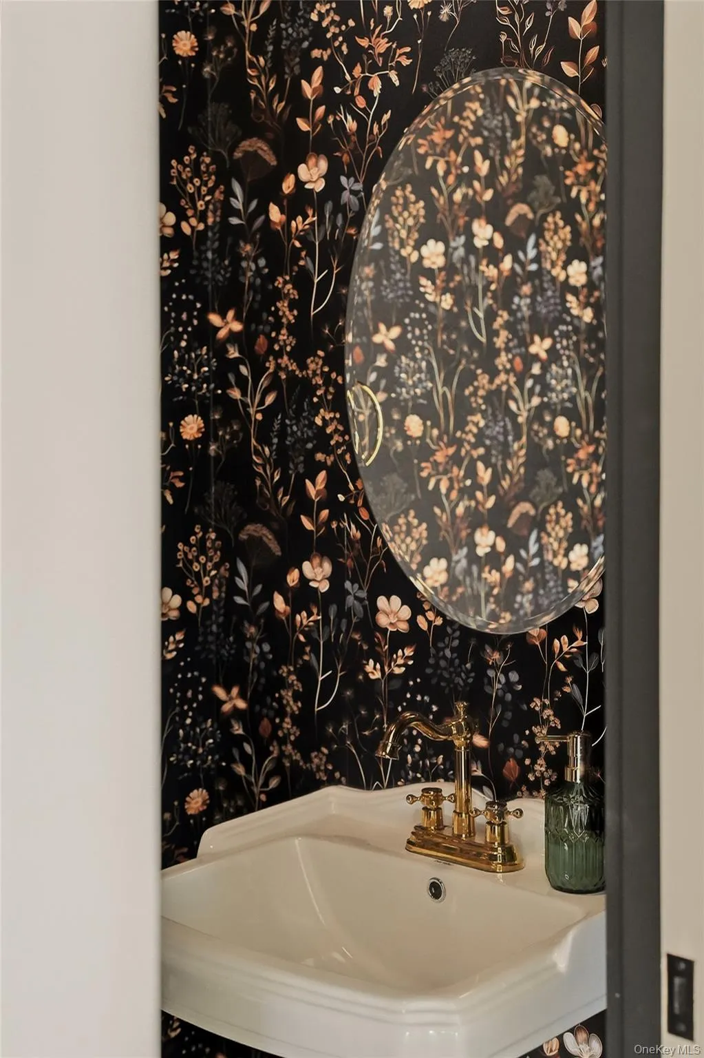 The powder room makes a statement with beautiful floral wallpaper reminding us that when done right, some things never go out of style The powder room makes a statement with beautiful floral wallpaper reminding us that when done right, some things never go out of style
