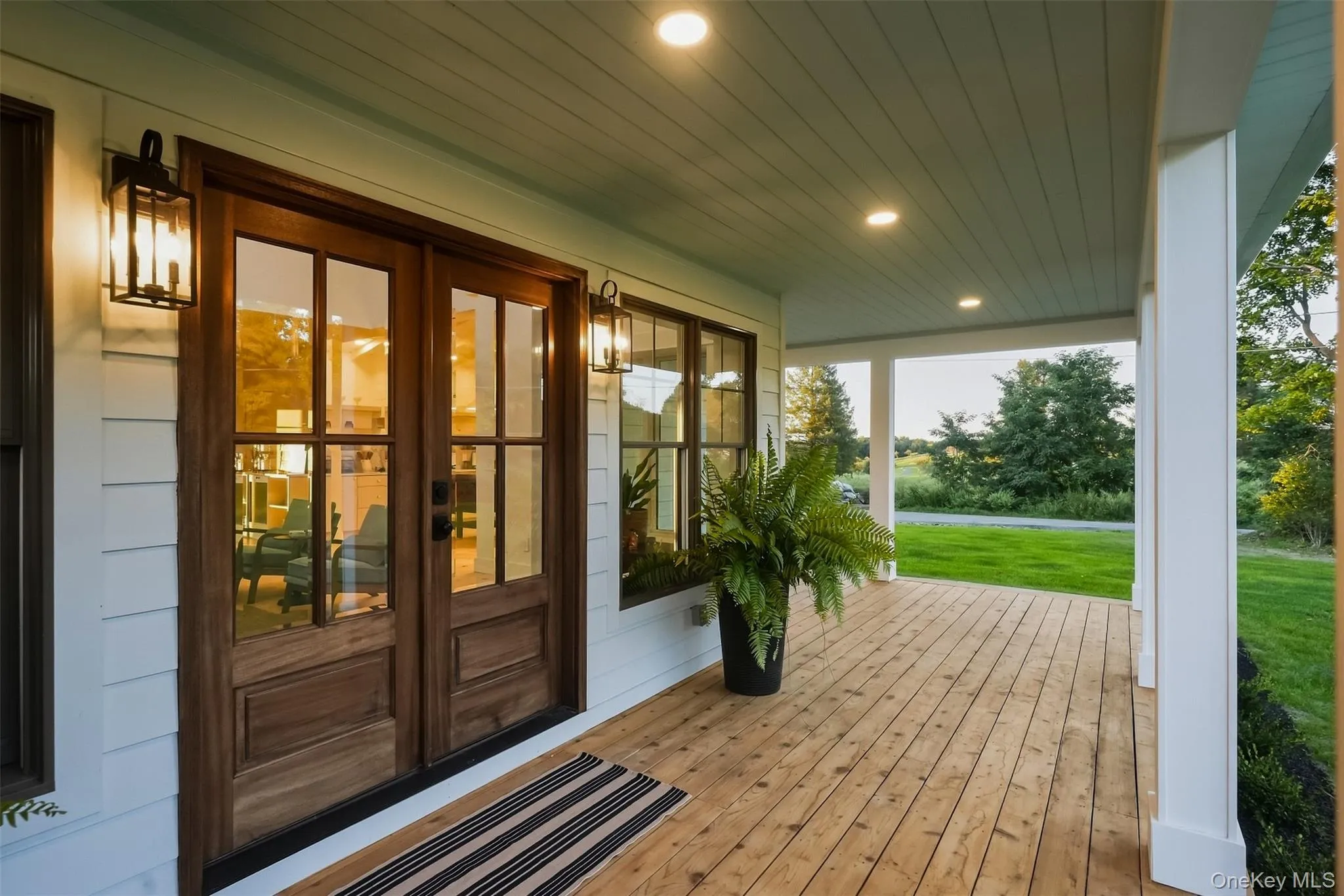 The light blue ceiling on the covered front porch is one of those simple design decisions that really steps it up and shows that those little details matter The light blue ceiling on the covered front porch is one of those simple design decisions that really steps it up and shows that those little details matter