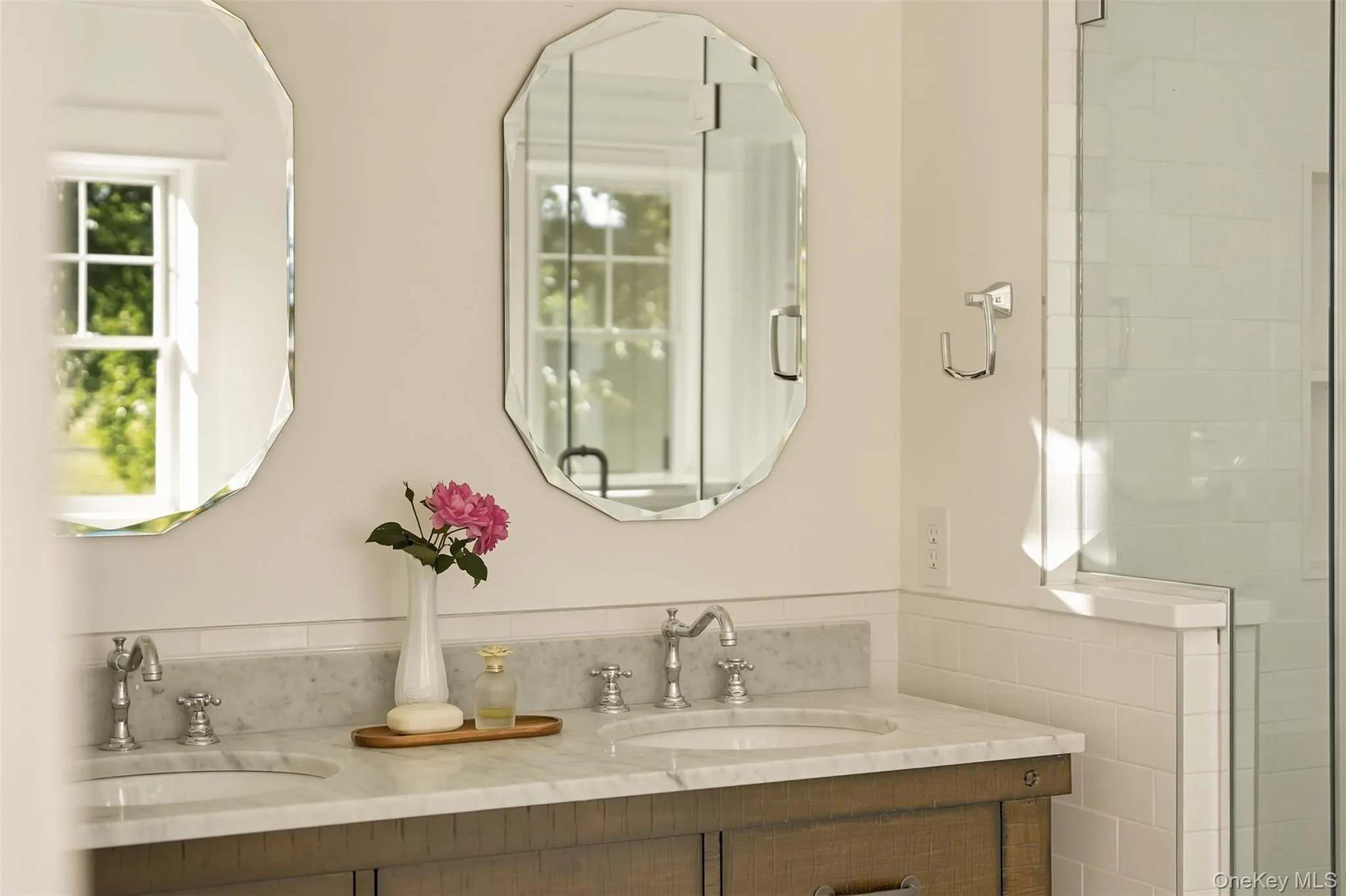 Dbl vanity with stone countertops, beauitful mirrors, clawfoot soaking tub, linen closet, a glass/tile shower and a walk in closet Dbl vanity with stone countertops, beauitful mirrors, clawfoot soaking tub, linen closet, a glass/tile shower and a walk in closet