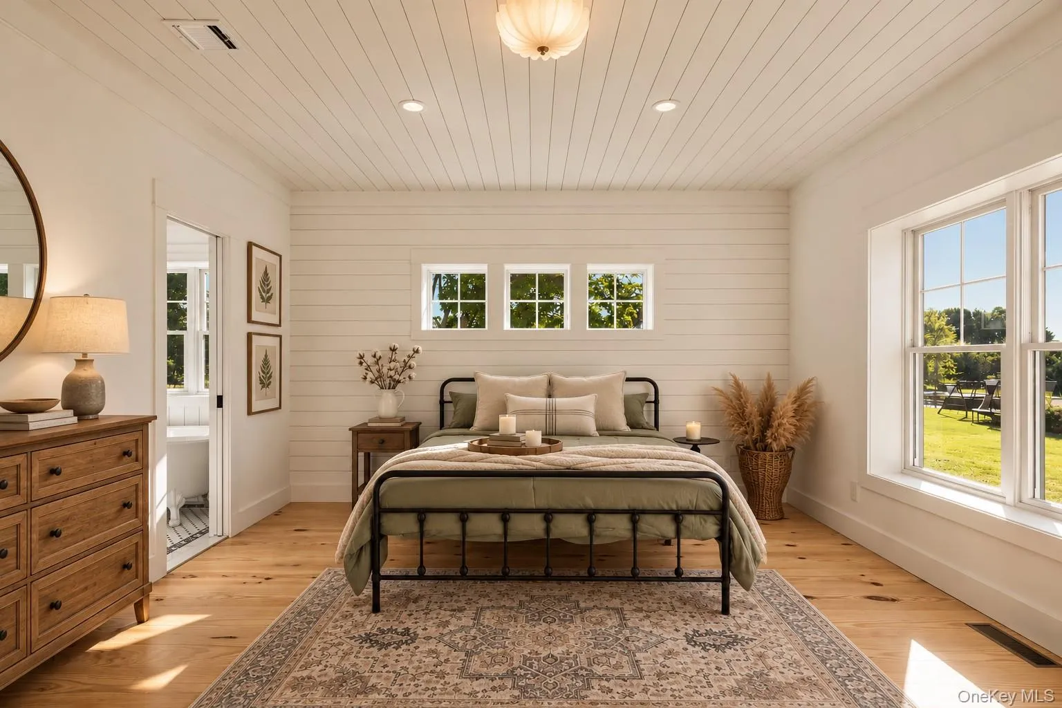 A thoughtfully designed bedroom on the main level, with a spa-like ensuite and walk-in closet A thoughtfully designed bedroom on the main level, with a spa-like ensuite and walk-in closet