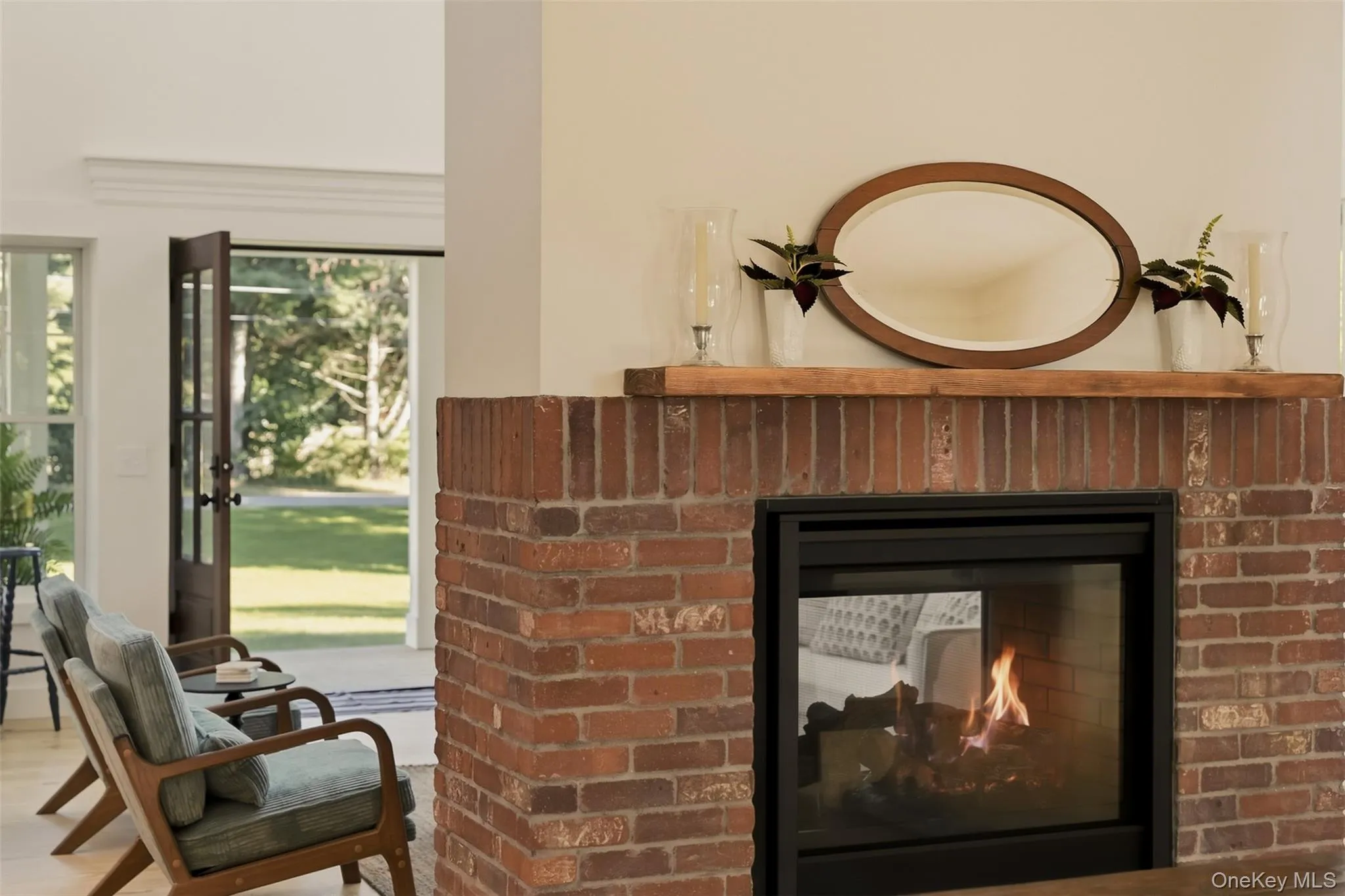 Double sided brick fireplace with wood mantel Double sided brick fireplace with wood mantel