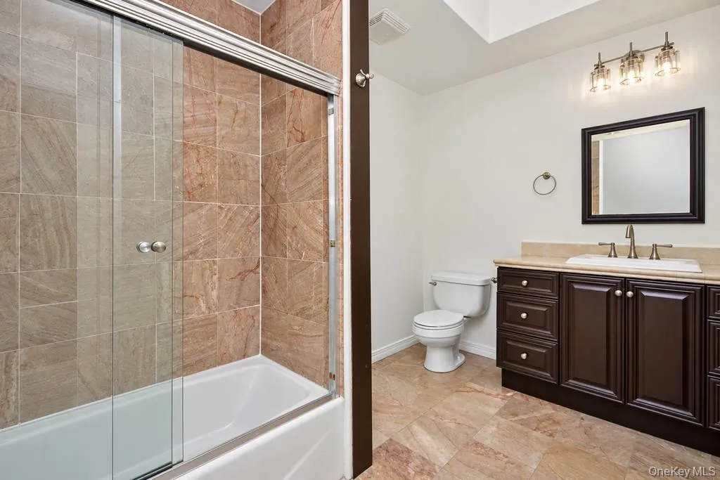 Updated Bathroom featuring a bathtub with shower Updated Bathroom featuring a bathtub with shower