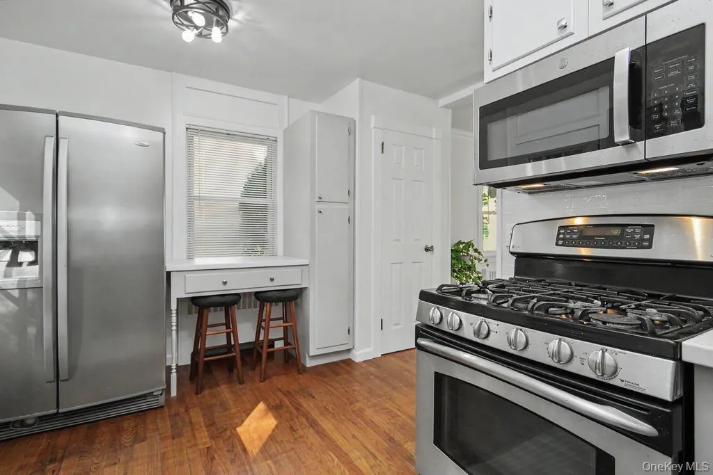 Stainless appliances and pantry closet in Kitchen Stainless appliances and pantry closet in Kitchen