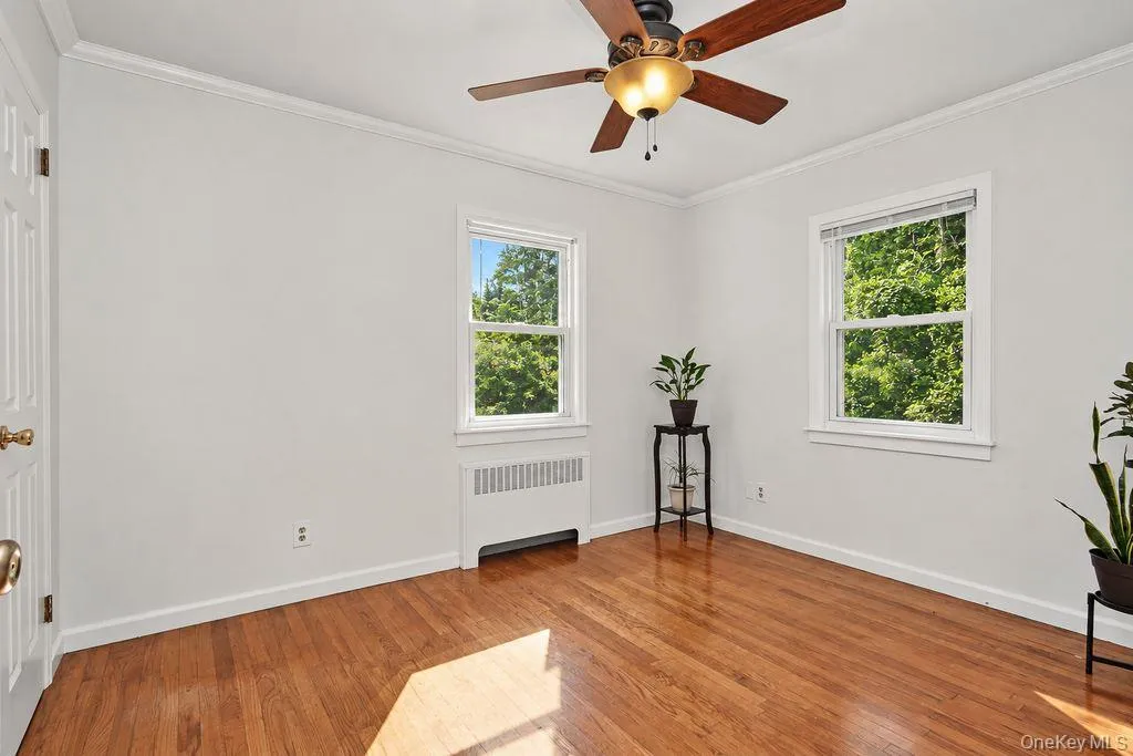 Bedroom on first floor has hardwood floors and a closet Bedroom on first floor has hardwood floors and a closet