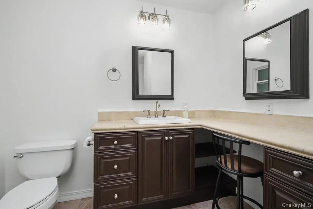 Sink with vanity and dressing table in bathroom Sink with vanity and dressing table in bathroom