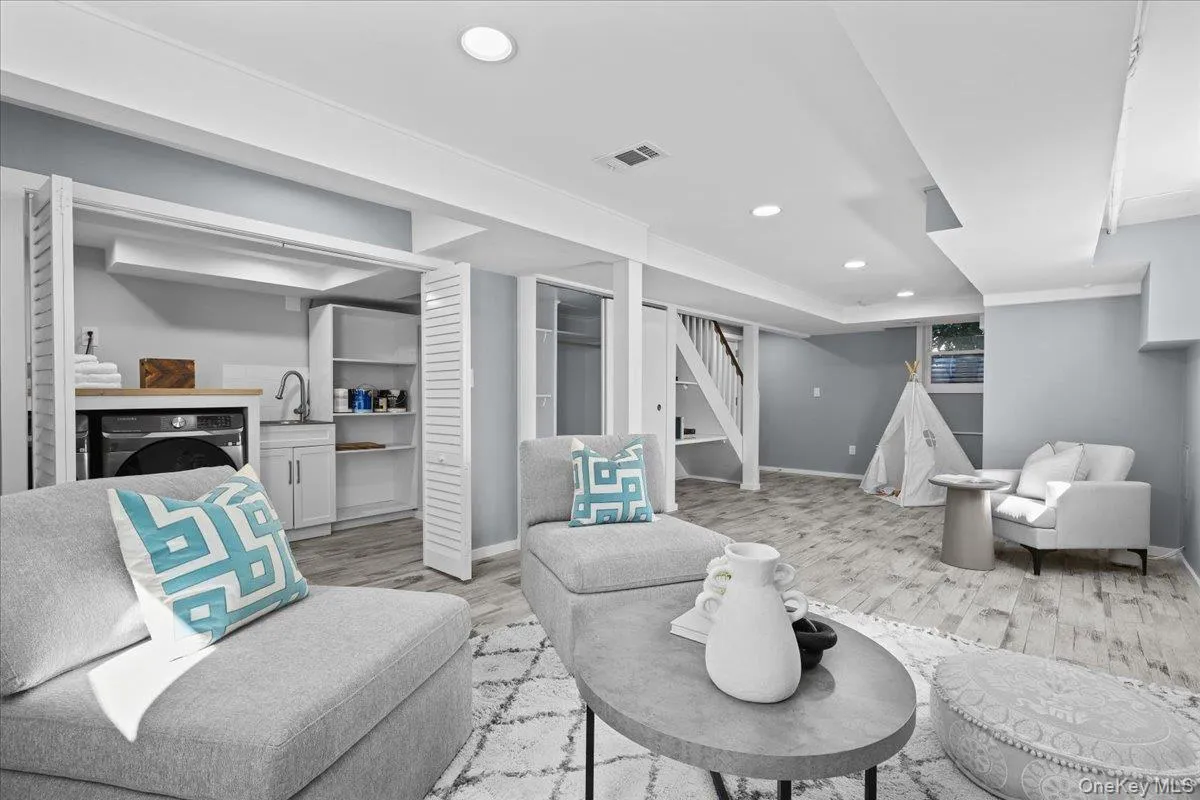 Finished basement space with laundry and access to tandem 2 car garage Finished basement space with laundry and access to tandem 2 car garage