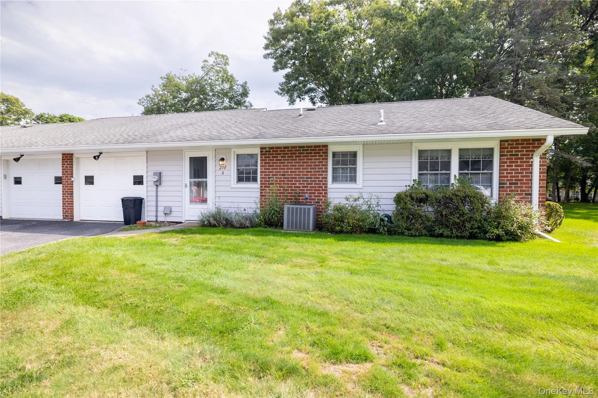 Rear exterior Brick and siding exterior with a shingle roof Rear exterior Brick and siding exterior with a shingle roof