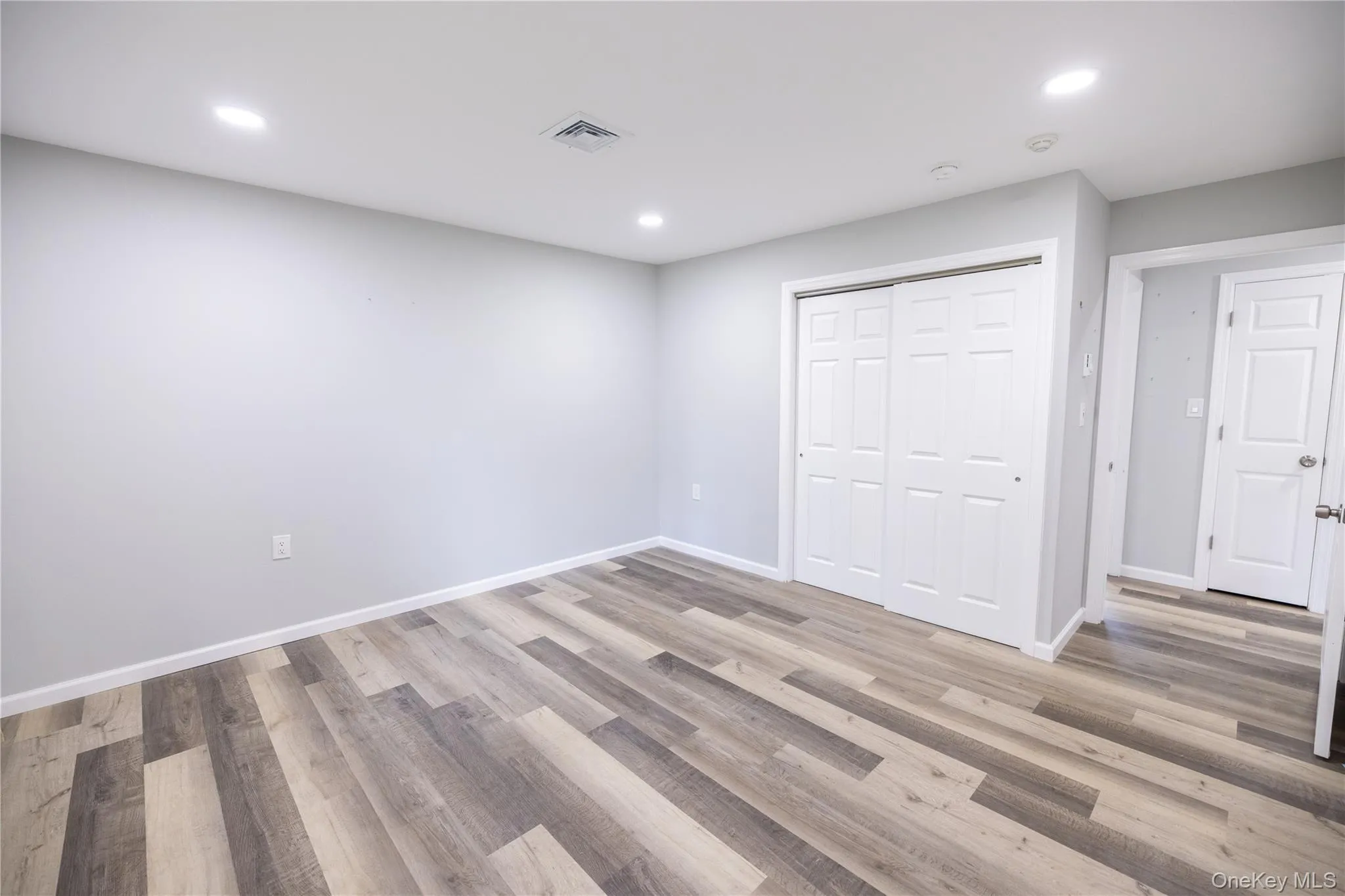 Recessed lighting, wood-finish flooring, and white trim throughout Recessed lighting, wood-finish flooring, and white trim throughout