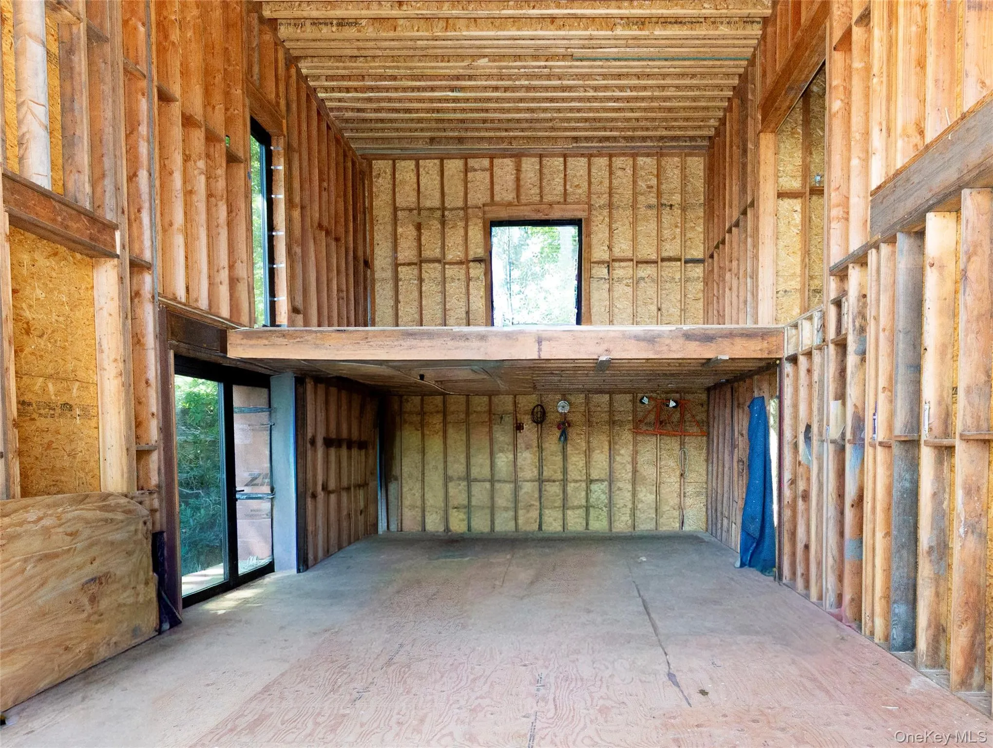 The kitchen planned around a back wall of cabinetry and appliances and a substantial island positioned in front. View of the loft above. The kitchen planned around a back wall of cabinetry and appliances and a substantial island positioned in front. View of the loft above.