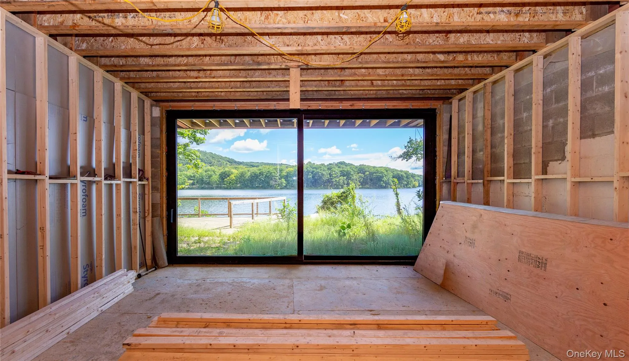Designed to include a large family room with sliding glass doors opening directly to the front deck, surrounding yard and waterfront. Designed to include a large family room with sliding glass doors opening directly to the front deck, surrounding yard and waterfront.