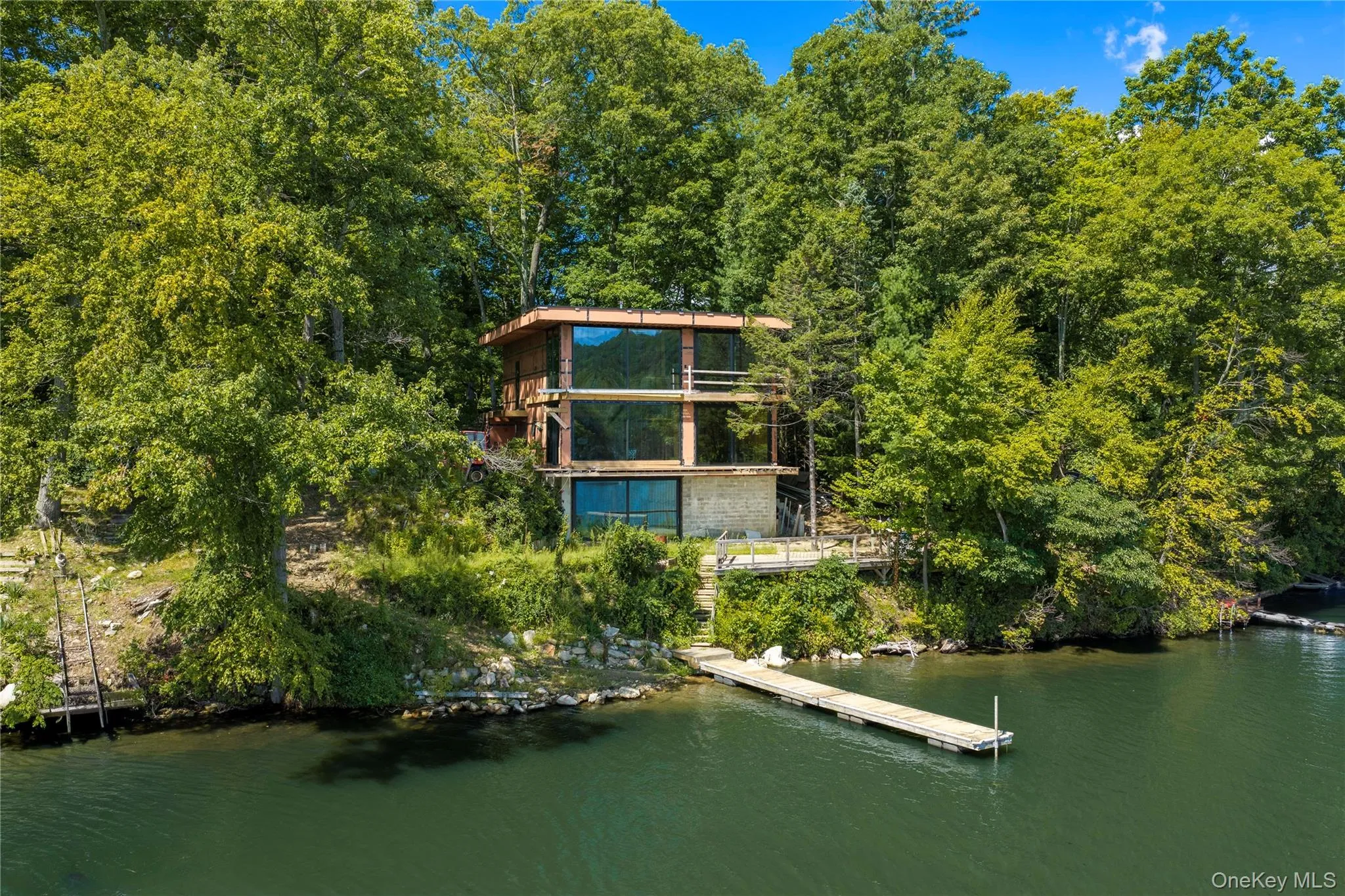 This is a once-in-a-lifetime opportunity to complete a modern architectural masterpiece on one of the most extraordinary settings imaginable—a private island in Whaley Lake. This is a once-in-a-lifetime opportunity to complete a modern architectural masterpiece on one of the most extraordinary settings imaginable—a private island in Whaley Lake.