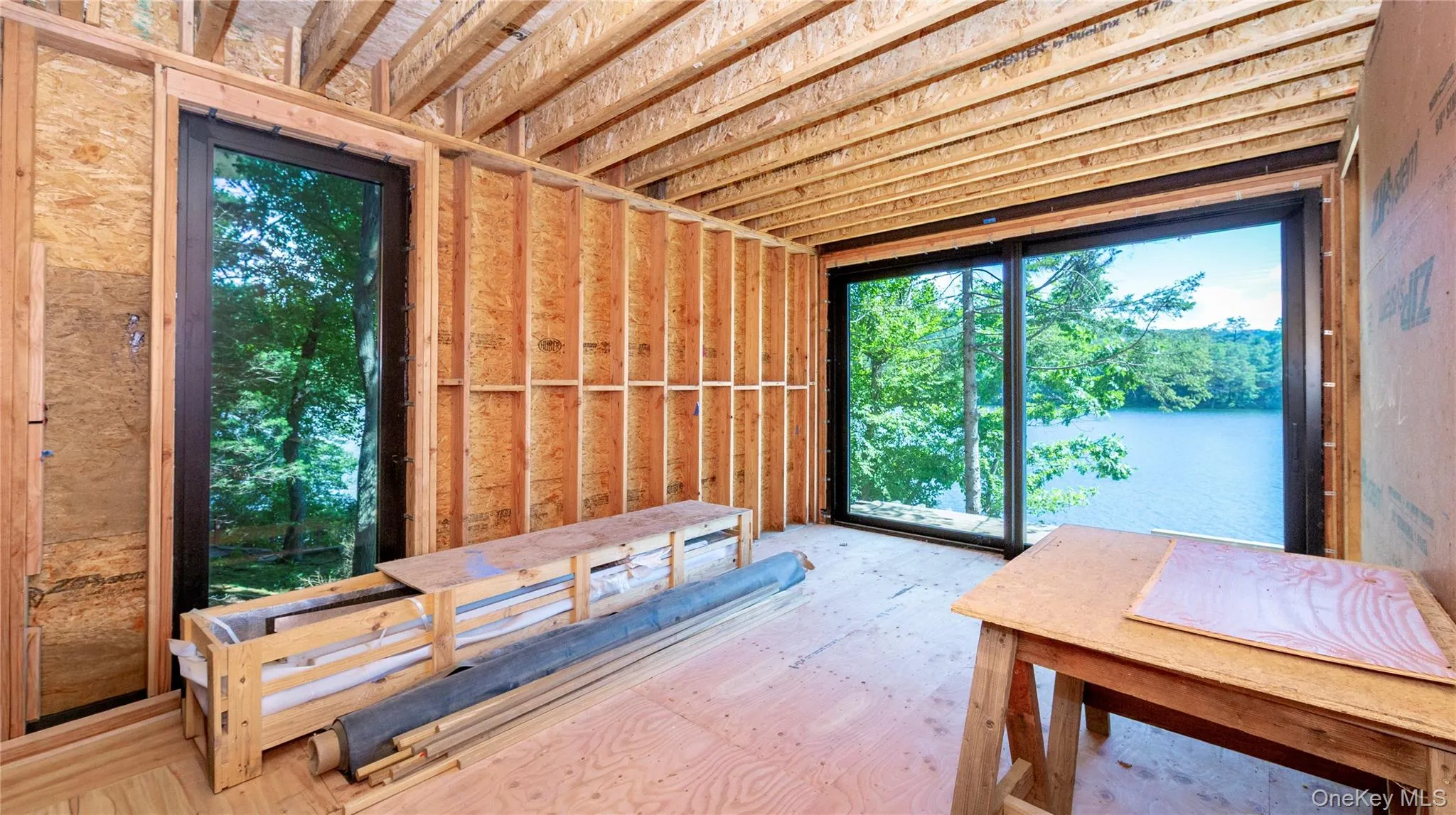 Primary bath behind with spectacular lake views through sliding glass doors. Primary bath behind with spectacular lake views through sliding glass doors.