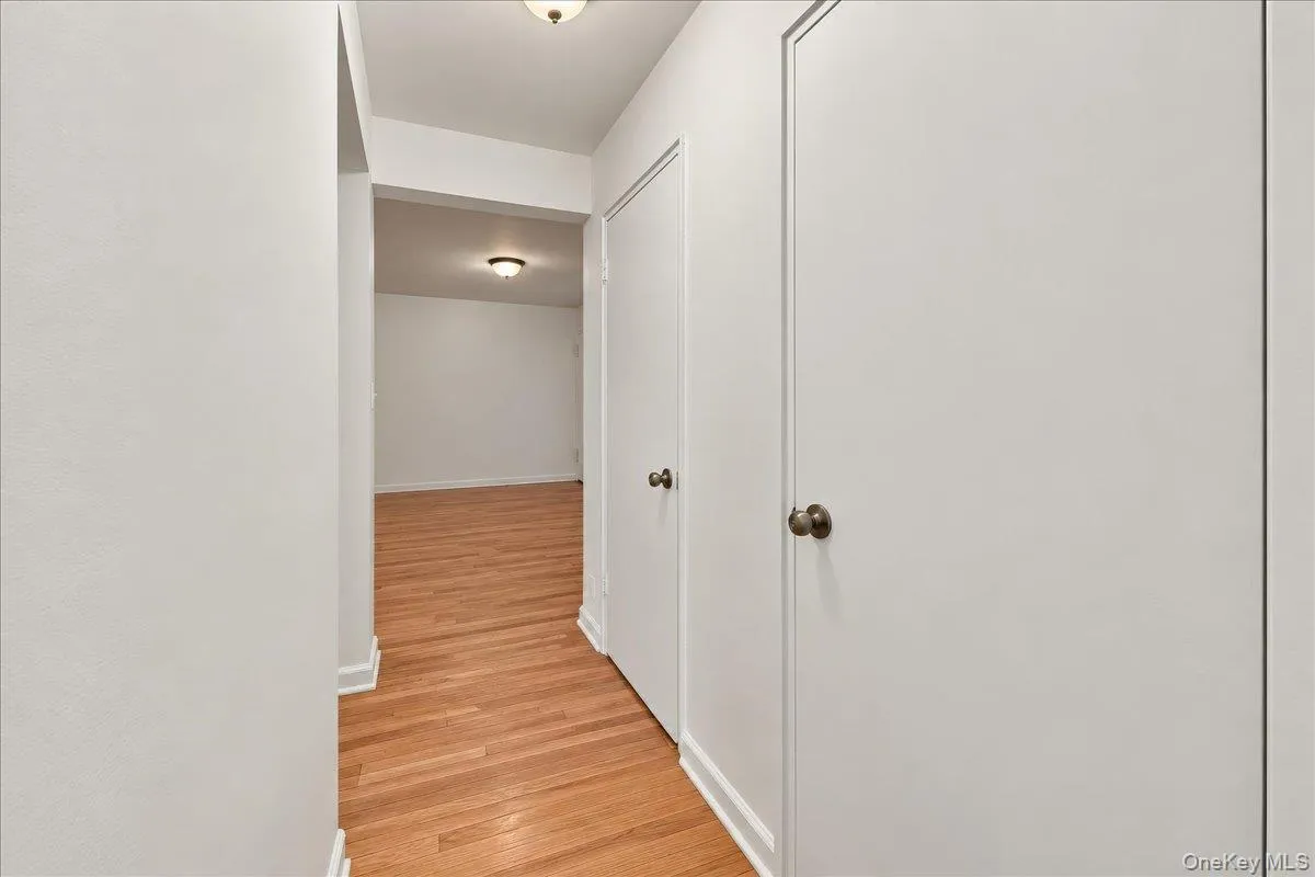 Hardwood flooring throughout, white painted walls, and built-in closet storage Hardwood flooring throughout, white painted walls, and built-in closet storage