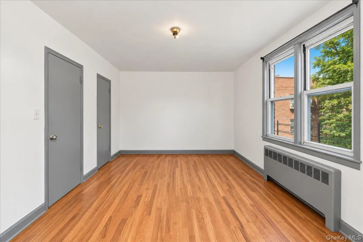 Hardwood flooring, painted trim, dual windows, and ceiling-mounted lighting Hardwood flooring, painted trim, dual windows, and ceiling-mounted lighting