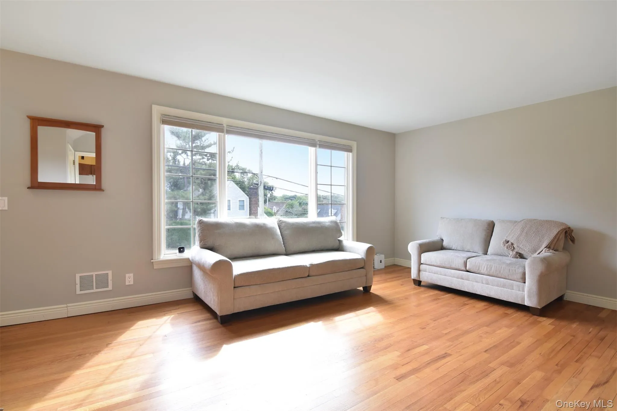 An oversized front window fills the space with incredible natural light. An oversized front window fills the space with incredible natural light.