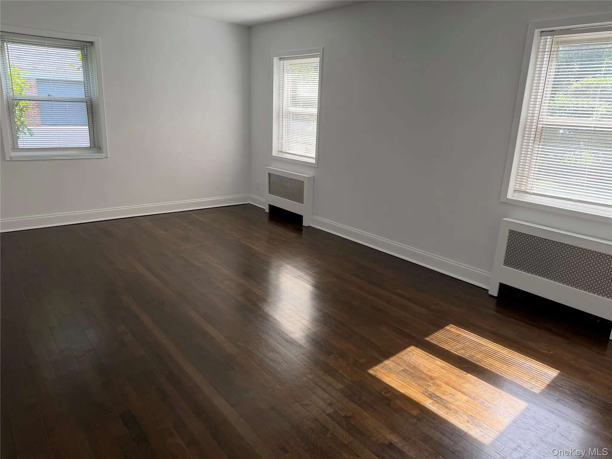 Spacious living room with dining area. Lots of windows. Spacious living room with dining area. Lots of windows.