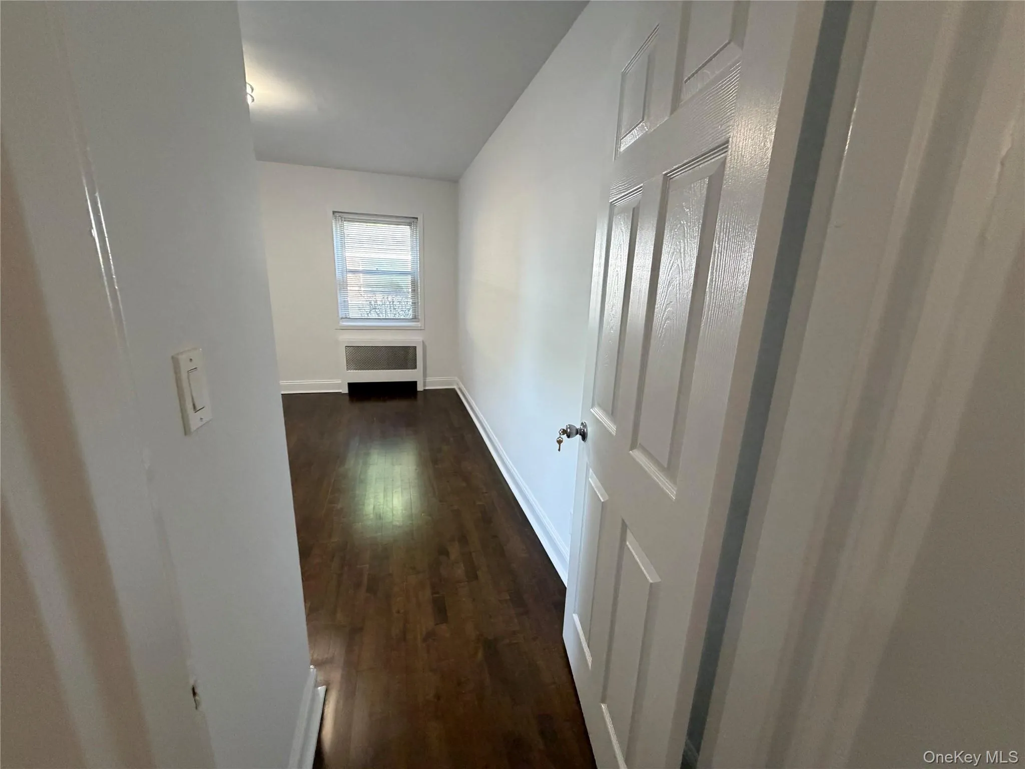 Entry to primary bedroom. New doors installed throughout the apartment. Entry to primary bedroom. New doors installed throughout the apartment.