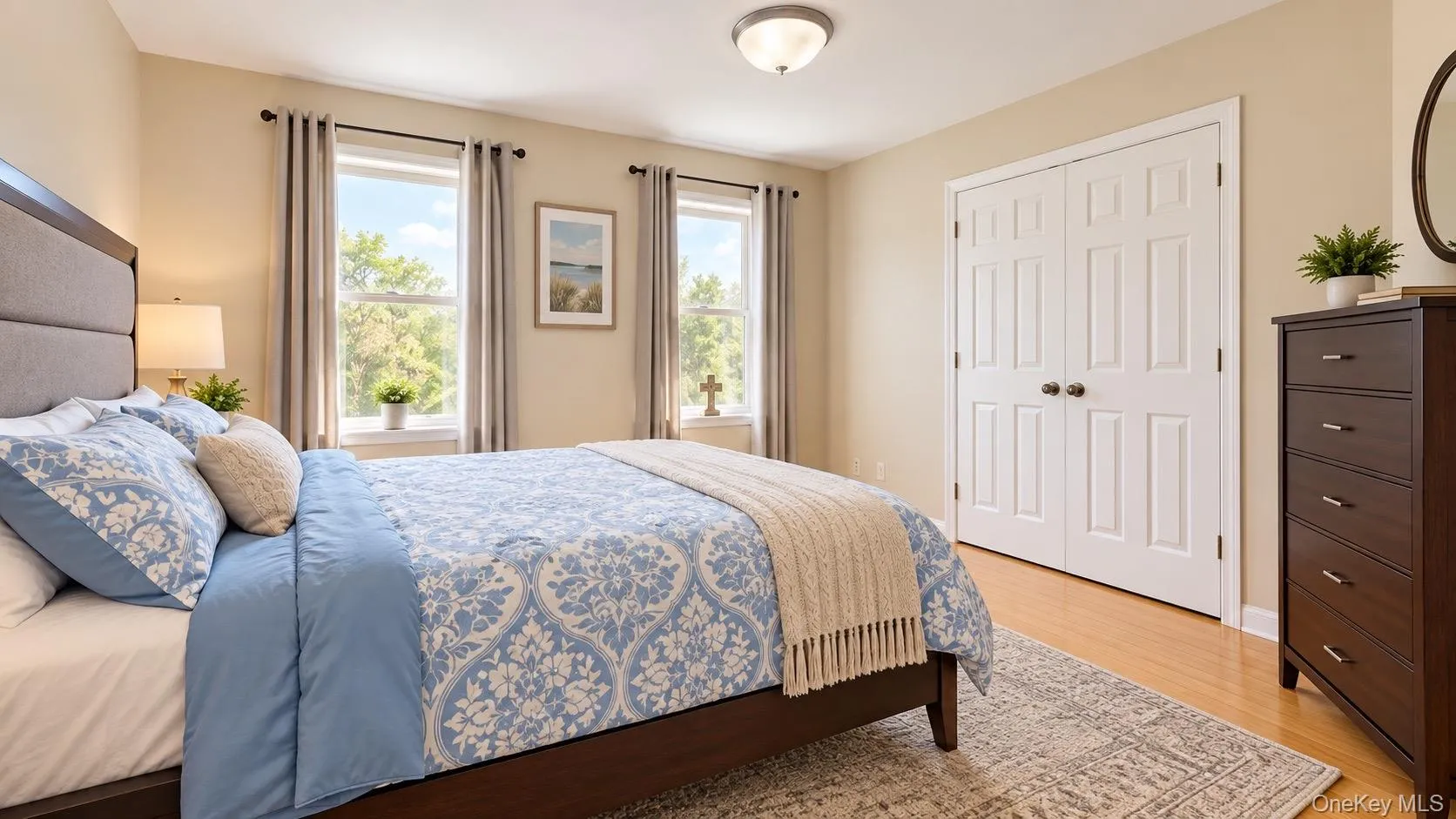 Hardwood flooring, dual pane windows, overhead light fixture, paneled bi-fold closet doors, and neutral wall tones Hardwood flooring, dual pane windows, overhead light fixture, paneled bi-fold closet doors, and neutral wall tones