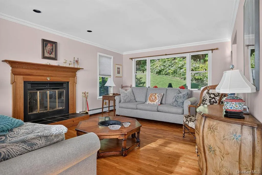 Bright living room with picture window and fireplace Bright living room with picture window and fireplace