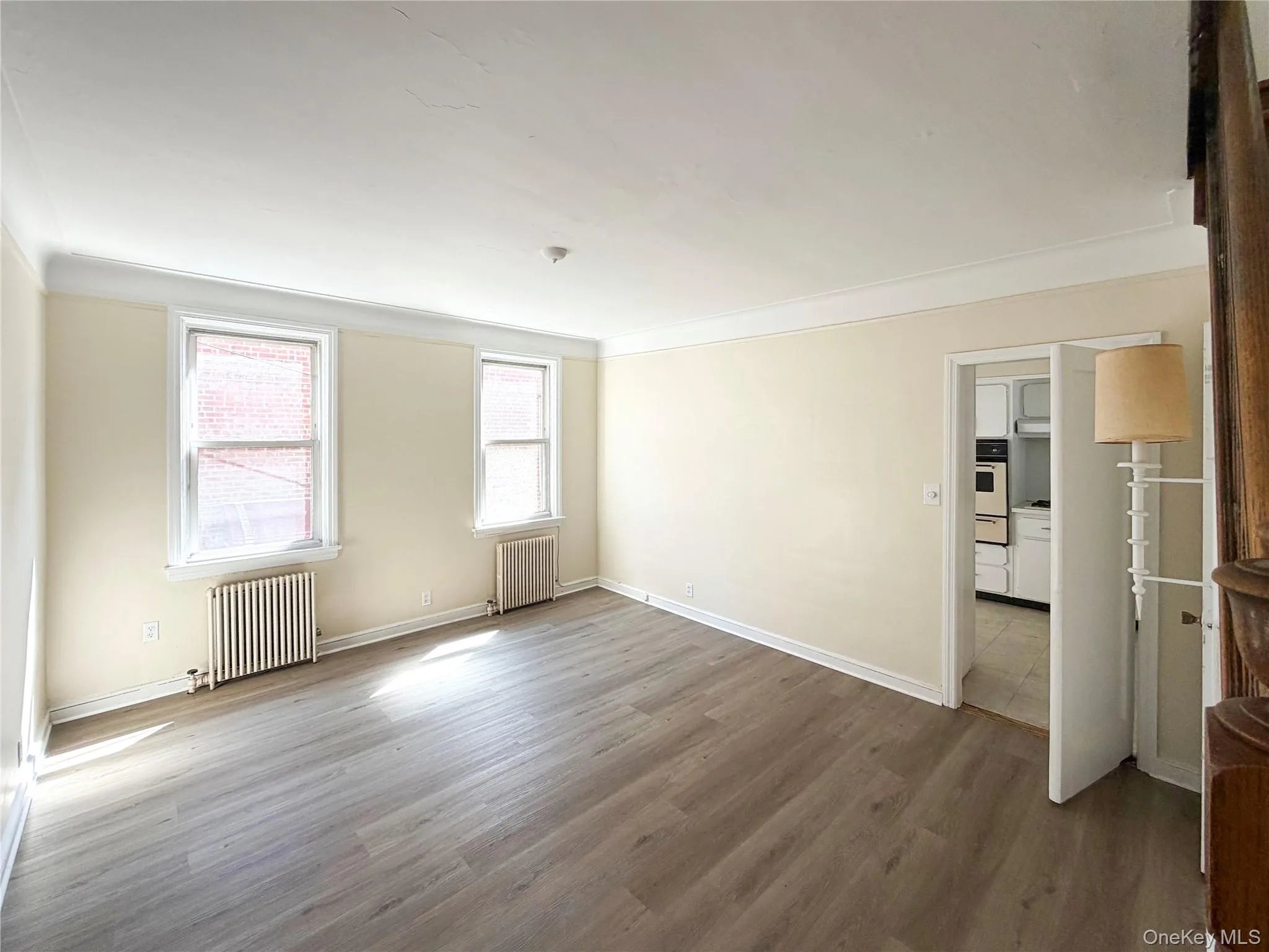 Engineered Wood-finish flooring throughout, complemented by crown molding and two windows Engineered Wood-finish flooring throughout, complemented by crown molding and two windows