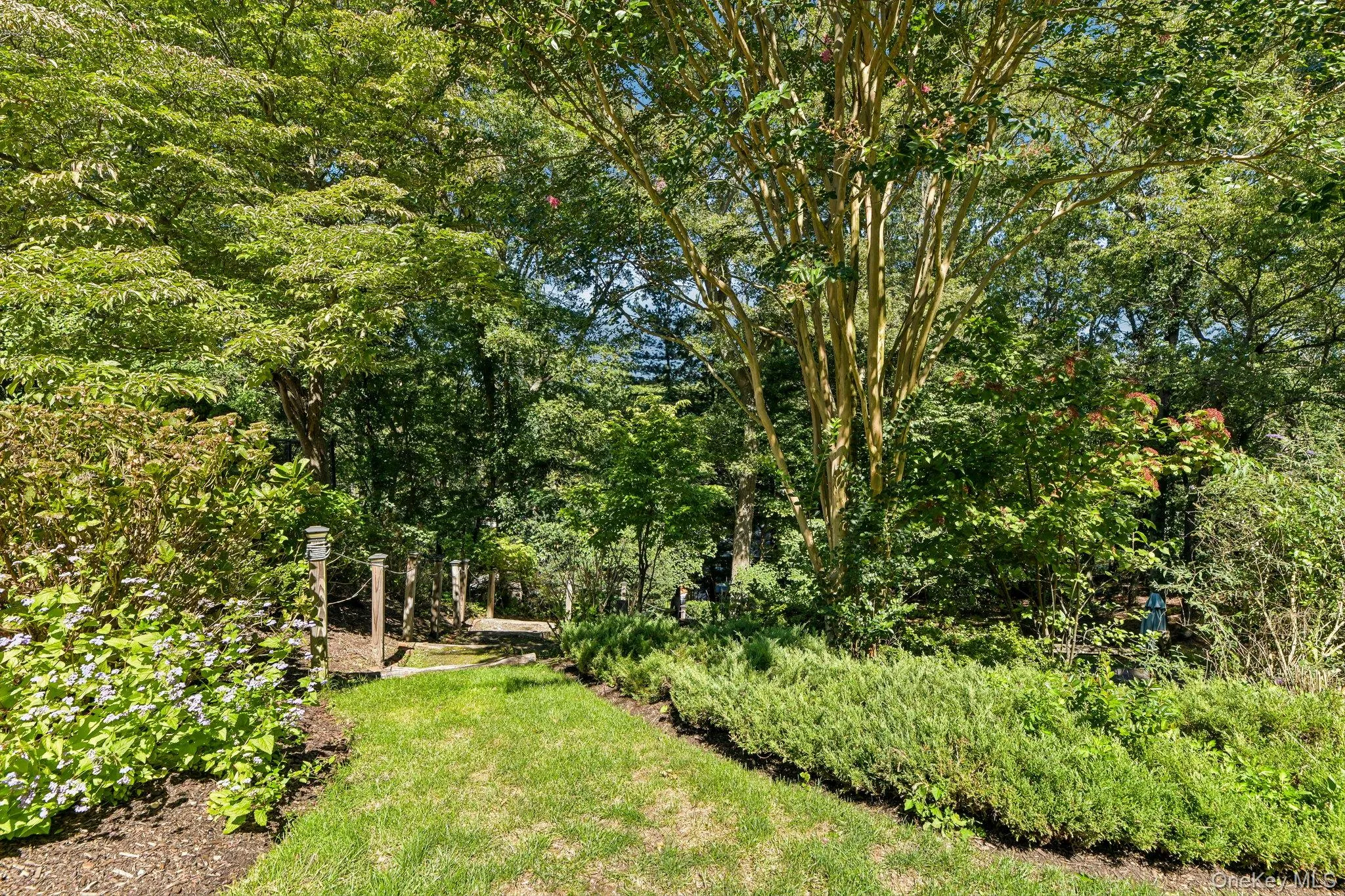Featuring specimen plantings and access to bocce court. Featuring specimen plantings and access to bocce court.