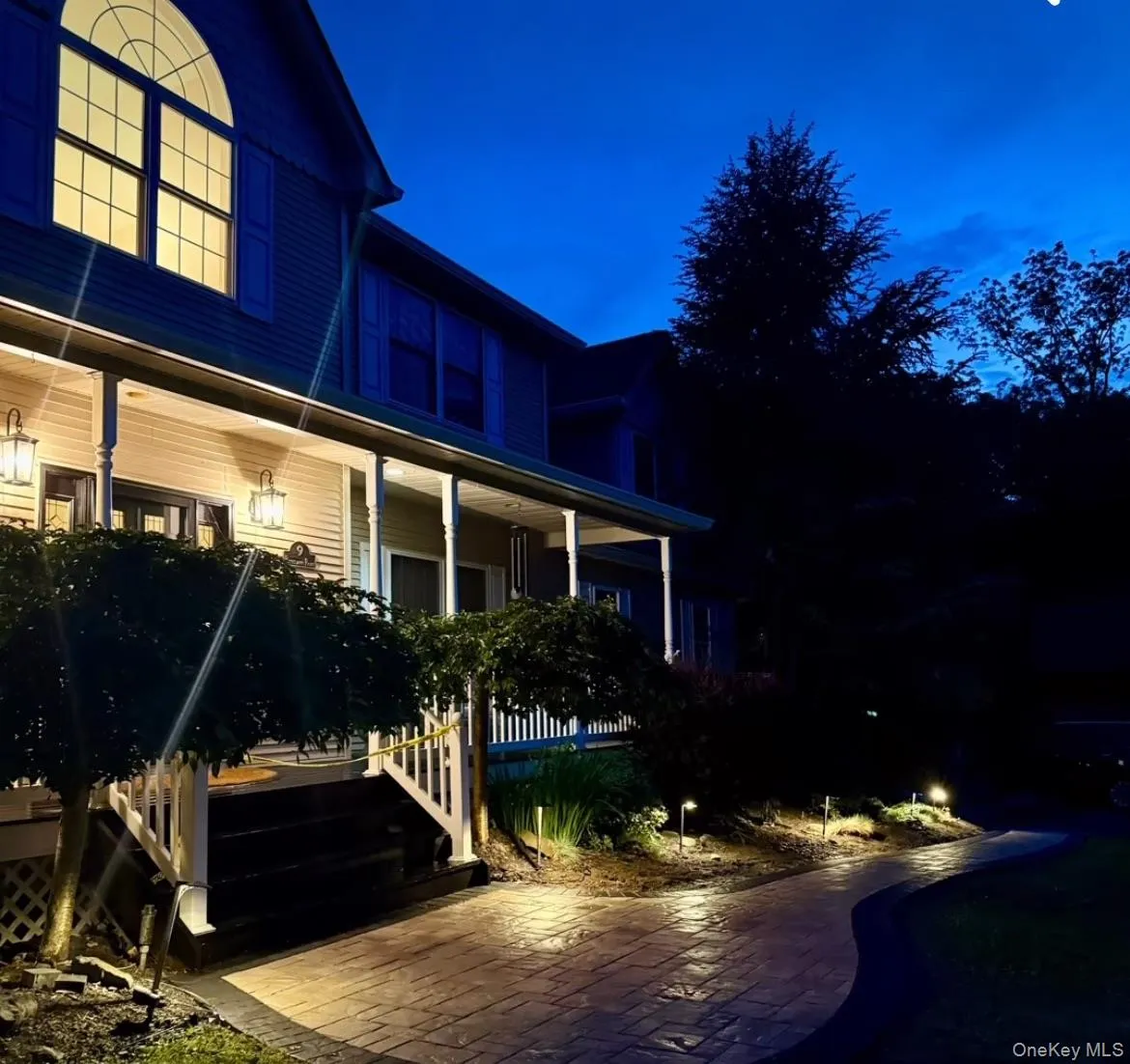 With stunning, new paver path leading from driveway to front porch. With stunning, new paver path leading from driveway to front porch.