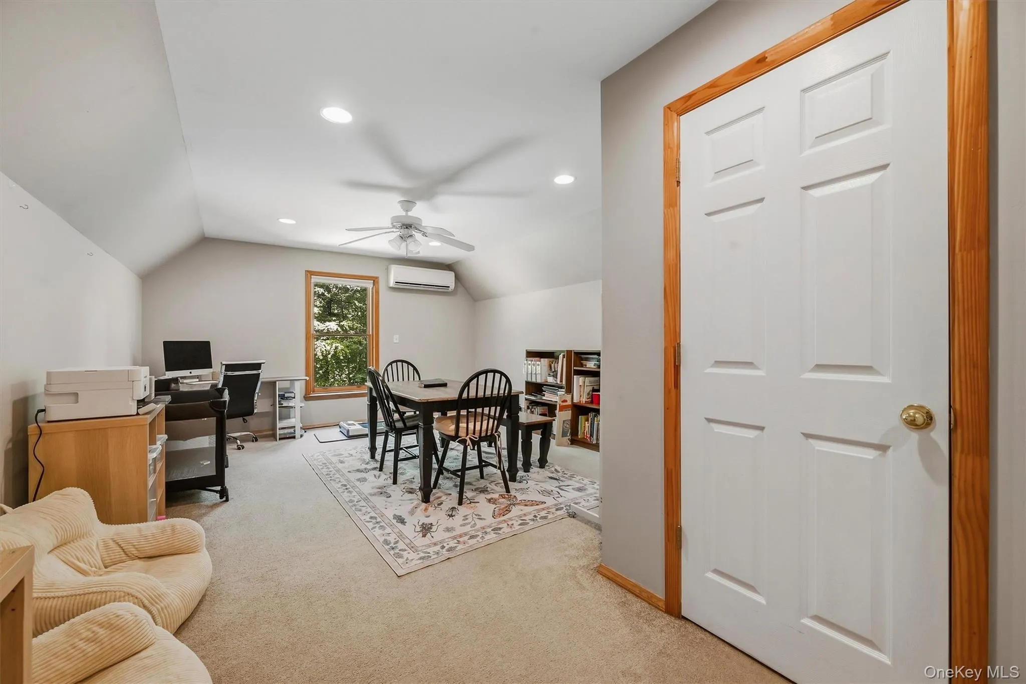 Versatile bonus room featuring vaulted ceilings with ceiling fan, recessed lighting, and wood-trimmed double-door closet Versatile bonus room featuring vaulted ceilings with ceiling fan, recessed lighting, and wood-trimmed double-door closet