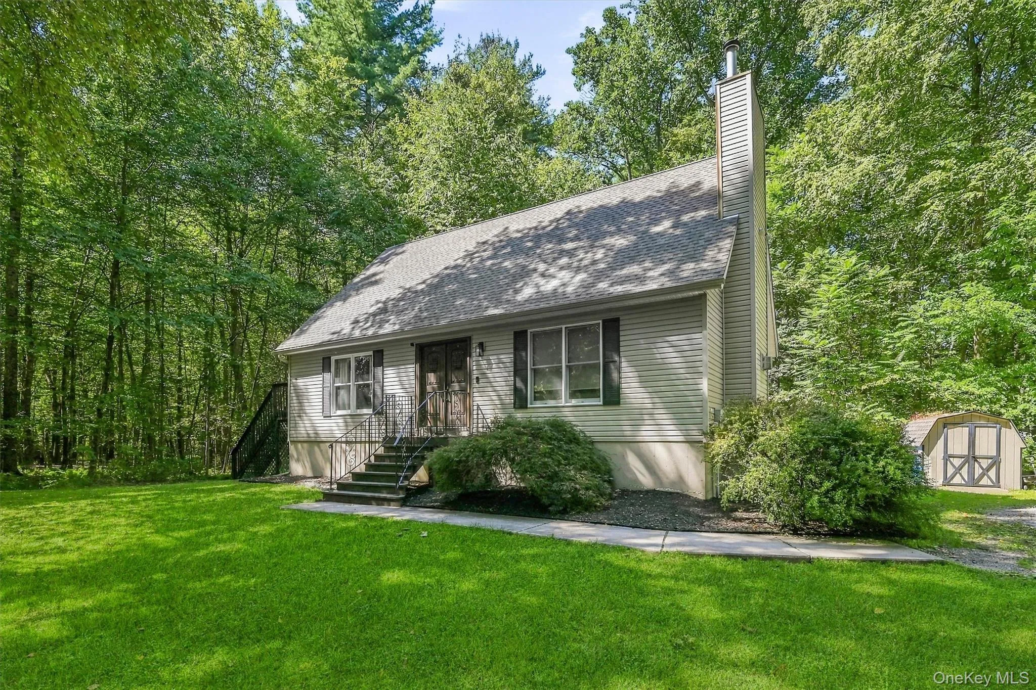 Siding exterior with a pitched roof and a prominent chimney Siding exterior with a pitched roof and a prominent chimney