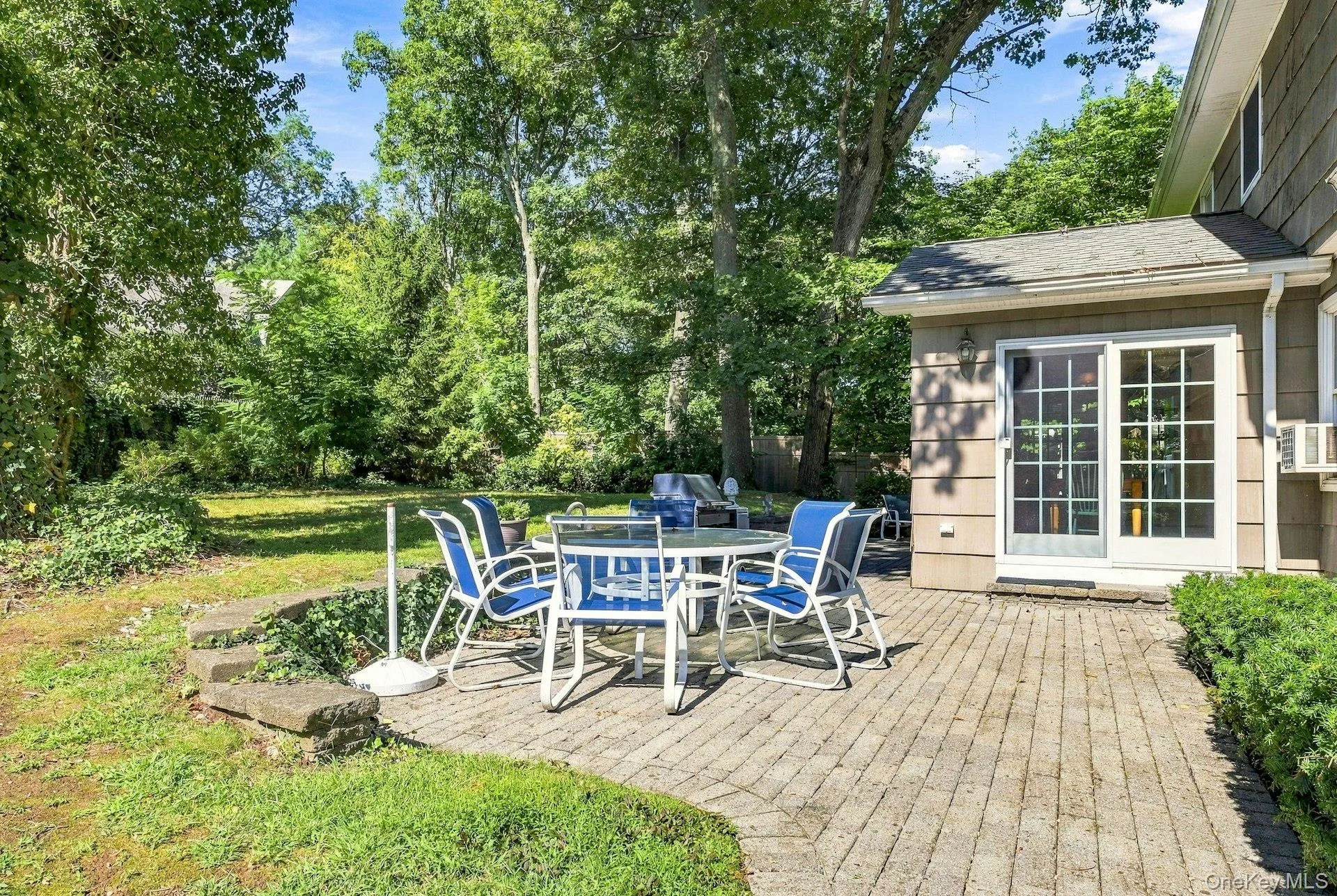 Backyard patio off of the kitchen. Backyard patio off of the kitchen.