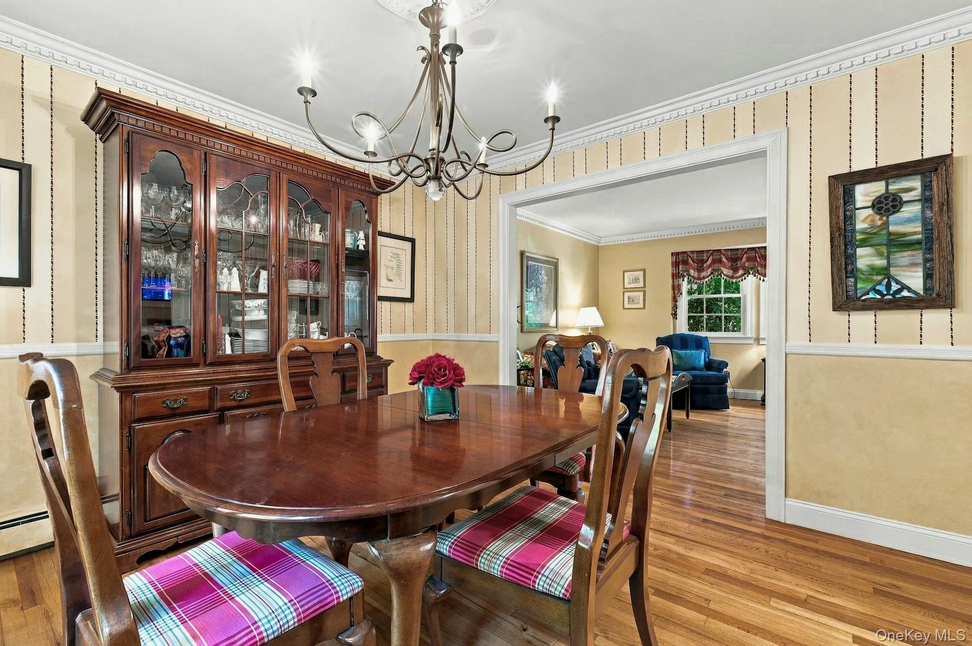 Formal Dining room with hardwood flooring leading into Living room Formal Dining room with hardwood flooring leading into Living room