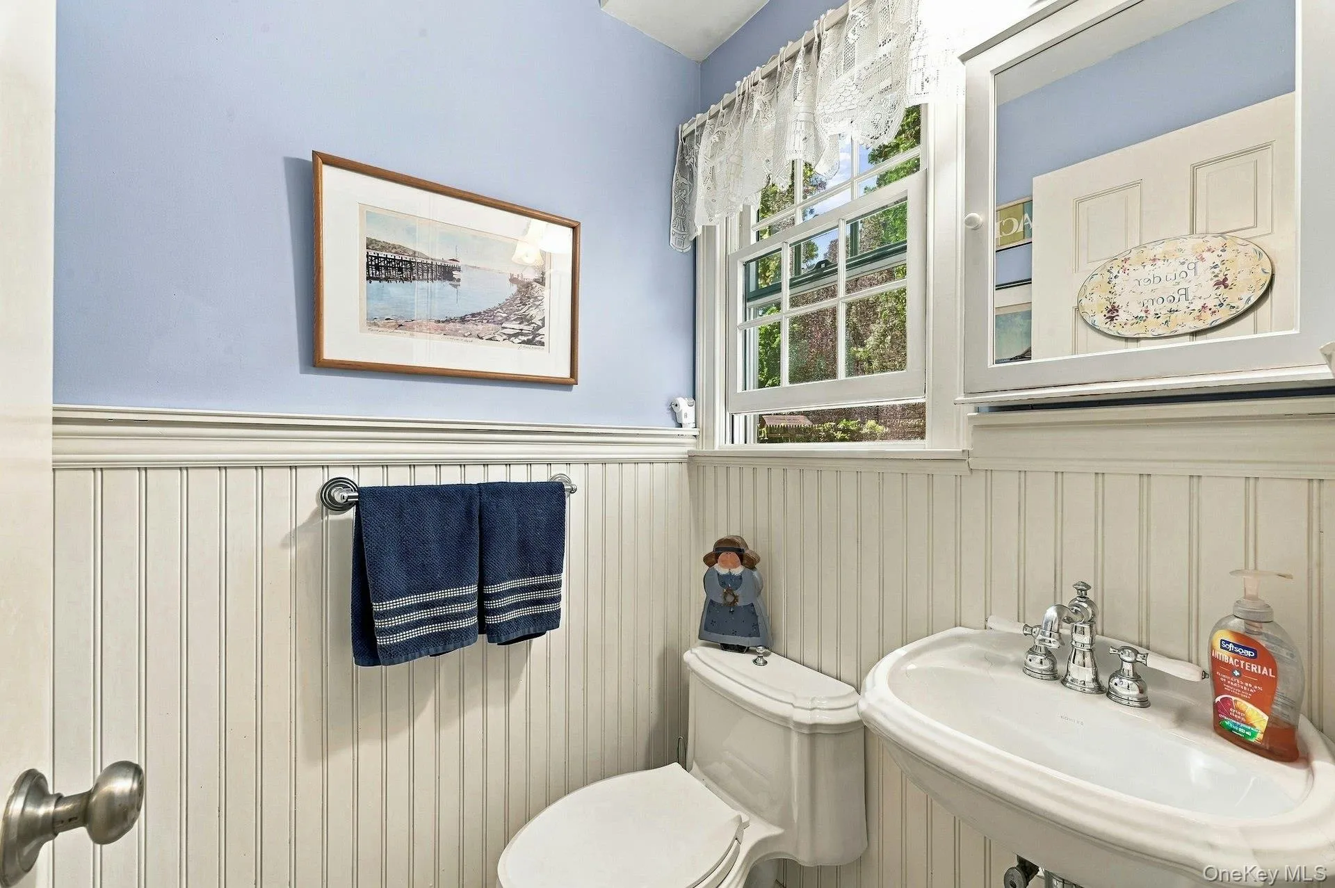 Half bath off of den and hallway. Half bath off of den and hallway.