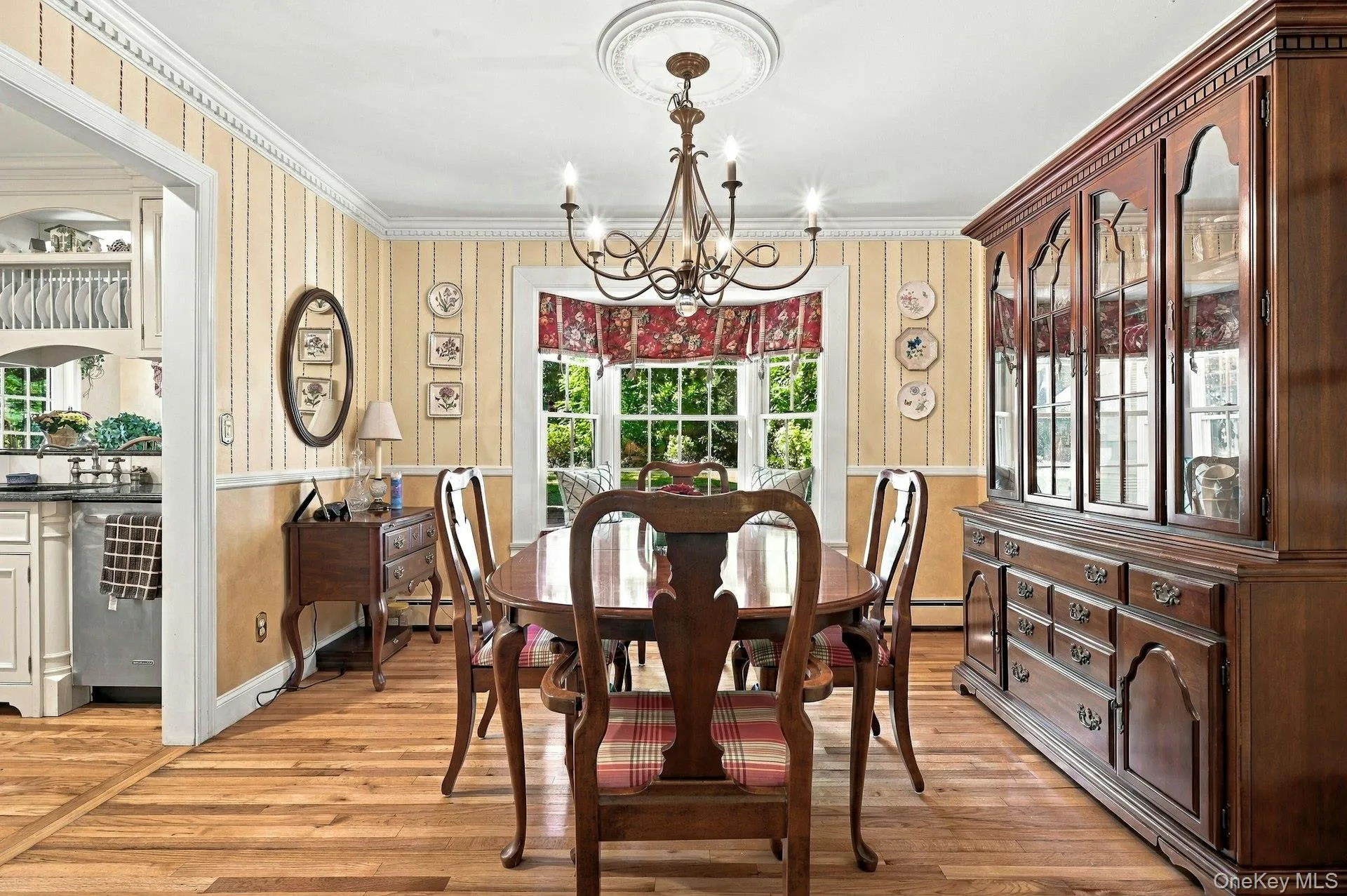 Formal Dining room viewed from living room, off of kitchen looking into the back property. Formal Dining room viewed from living room, off of kitchen looking into the back property.