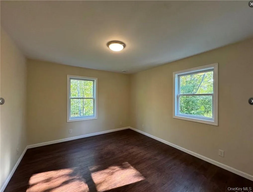 bedroom with dark hardwood / wood-style flooring bedroom with dark hardwood / wood-style flooring