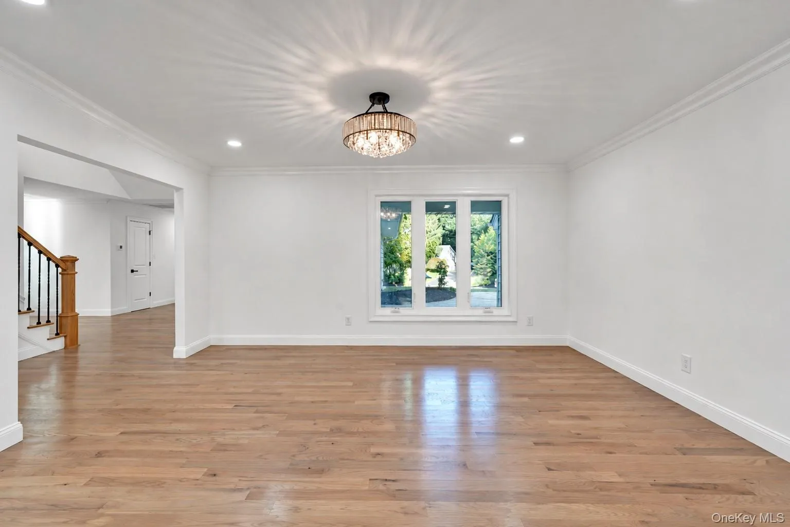 Formal Dining room with white oak floors and new windows. Formal Dining room with white oak floors and new windows.
