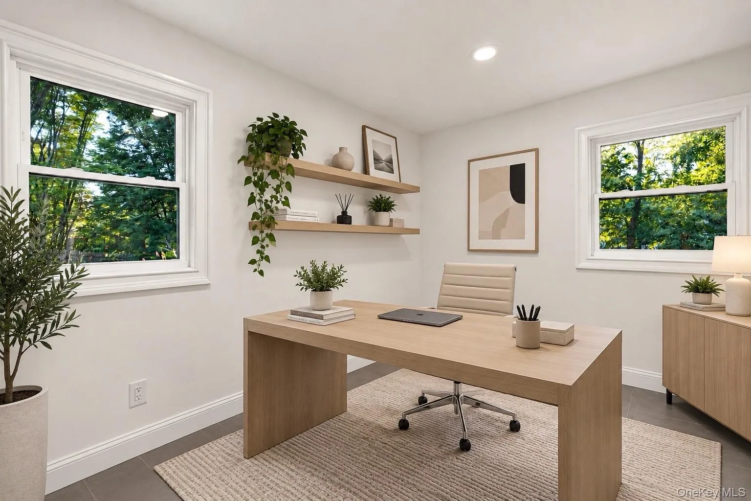 Gray tile flooring, white walls, recessed ceiling lighting, and two windows with white trim Gray tile flooring, white walls, recessed ceiling lighting, and two windows with white trim