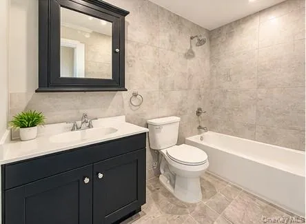 Black wood vanity with a white countertop and undermount sink Black wood vanity with a white countertop and undermount sink