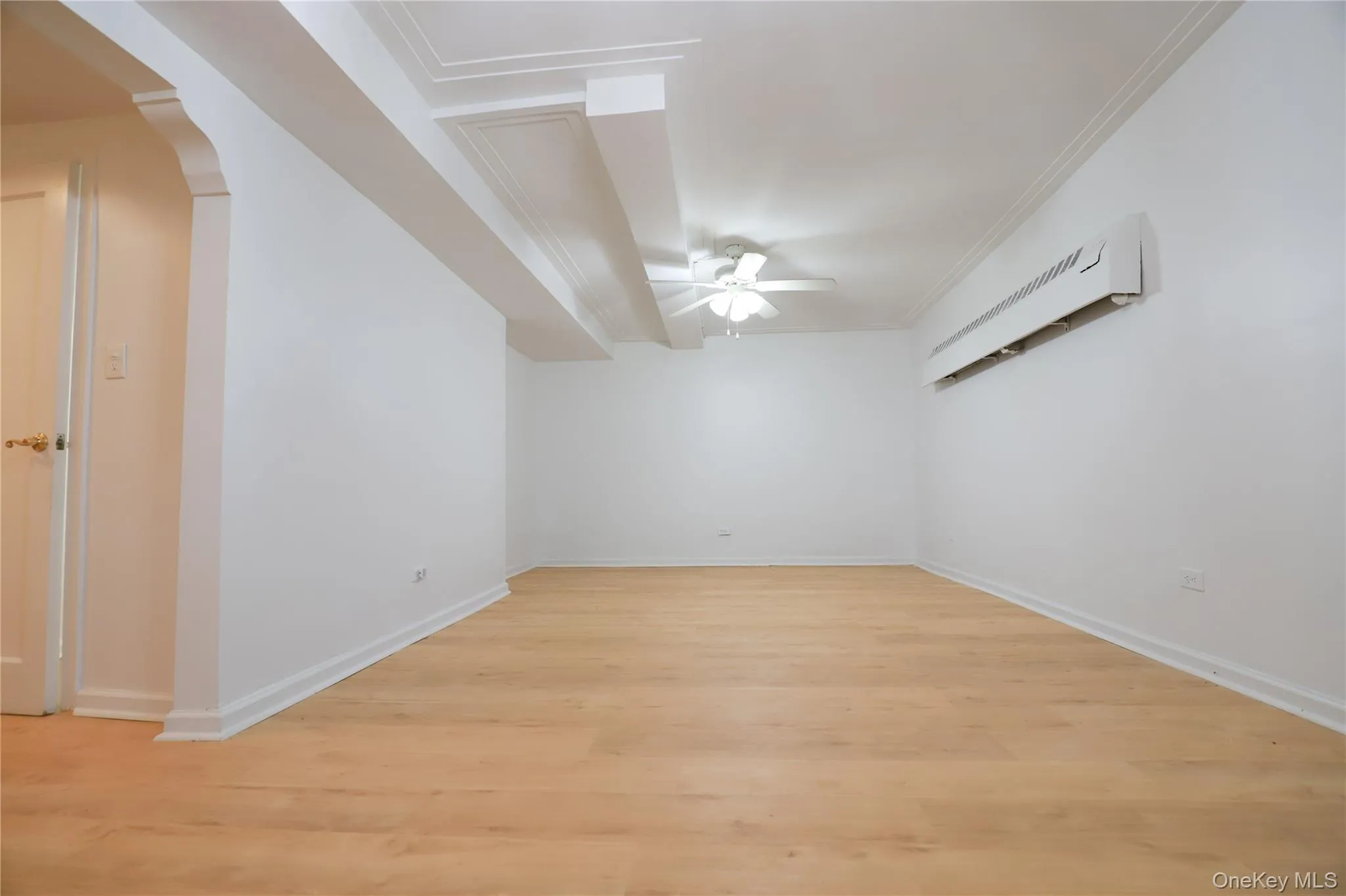 Large living room equipped with ceiling fan and AC unit Large living room equipped with ceiling fan and AC unit