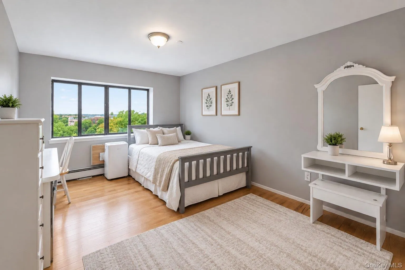 Hardwood-finish flooring and light gray walls create a neutral palette Hardwood-finish flooring and light gray walls create a neutral palette