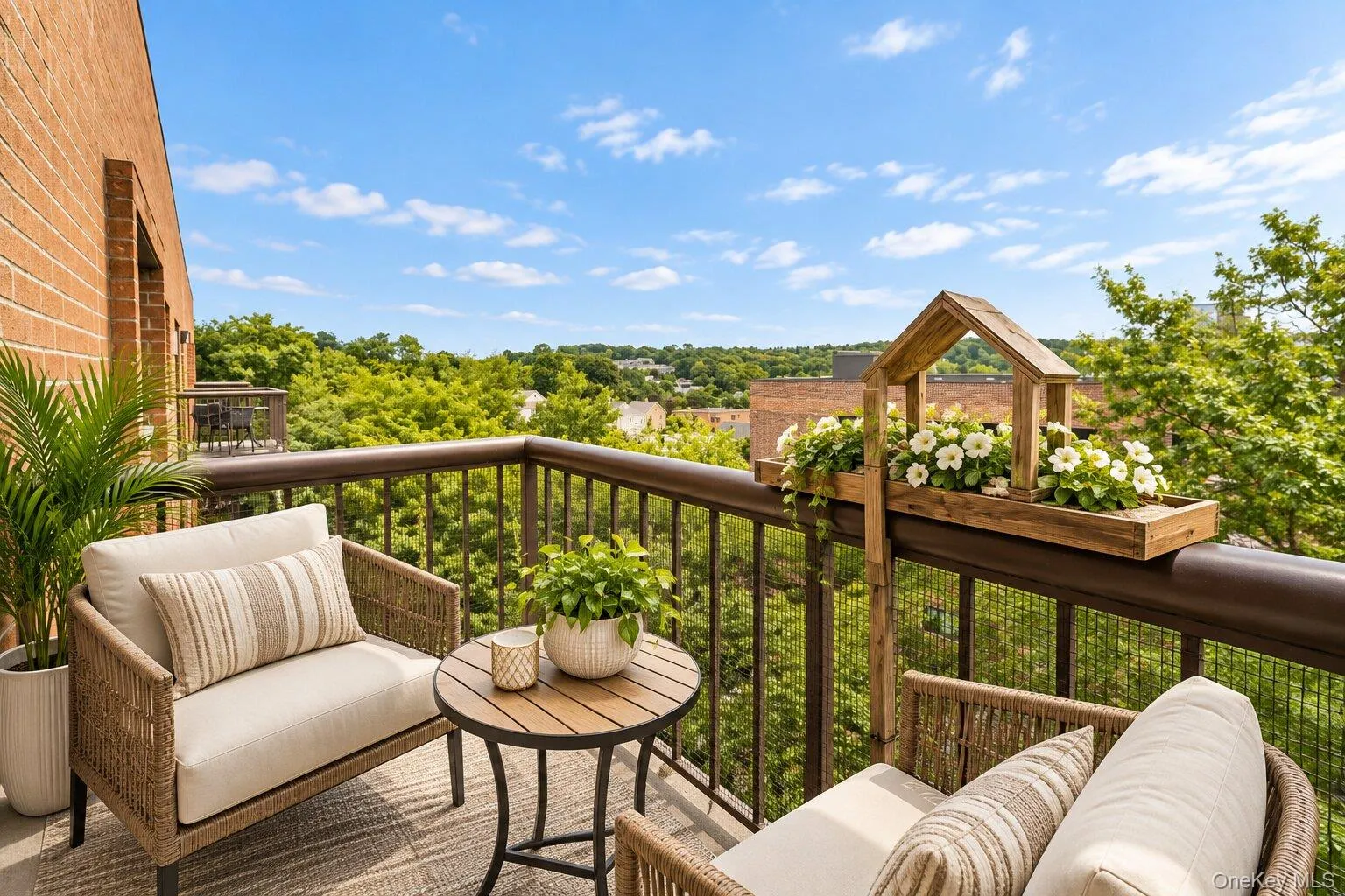 Private balcony featuring a brick exterior wall and metal railings Private balcony featuring a brick exterior wall and metal railings