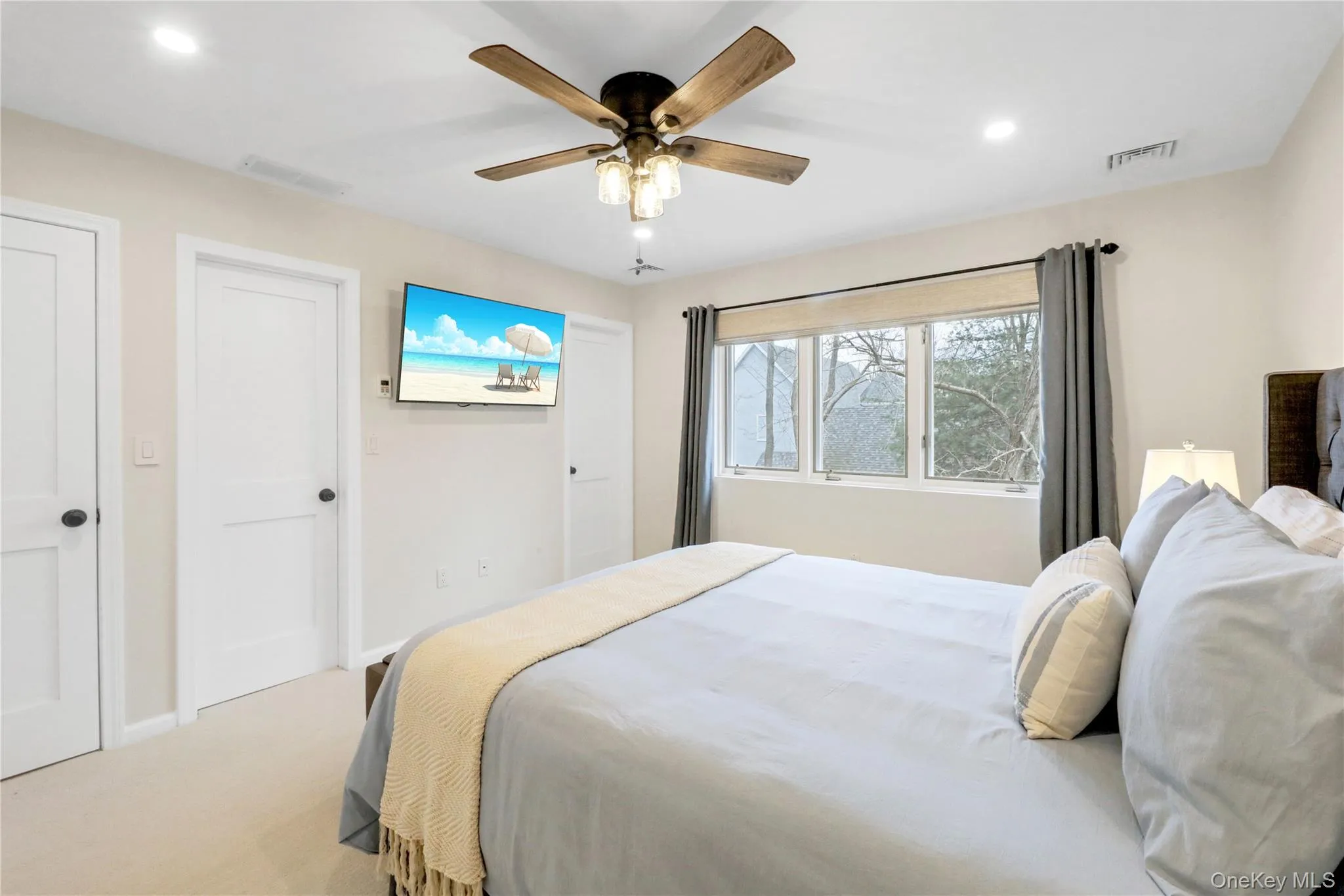 Bedroom with carpet floors, recessed lighting, and ceiling fan Bedroom with carpet floors, recessed lighting, and ceiling fan