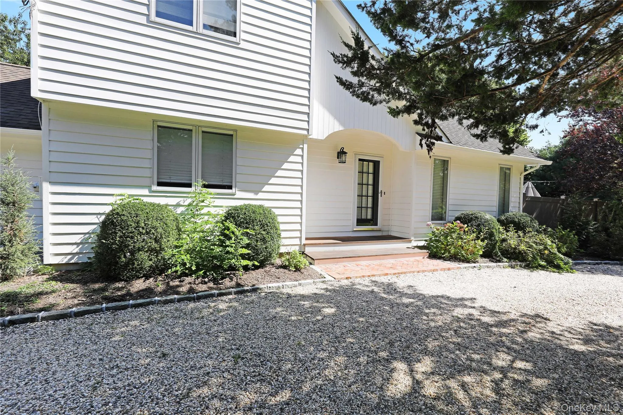 Property entrance with a shingled roof Property entrance with a shingled roof
