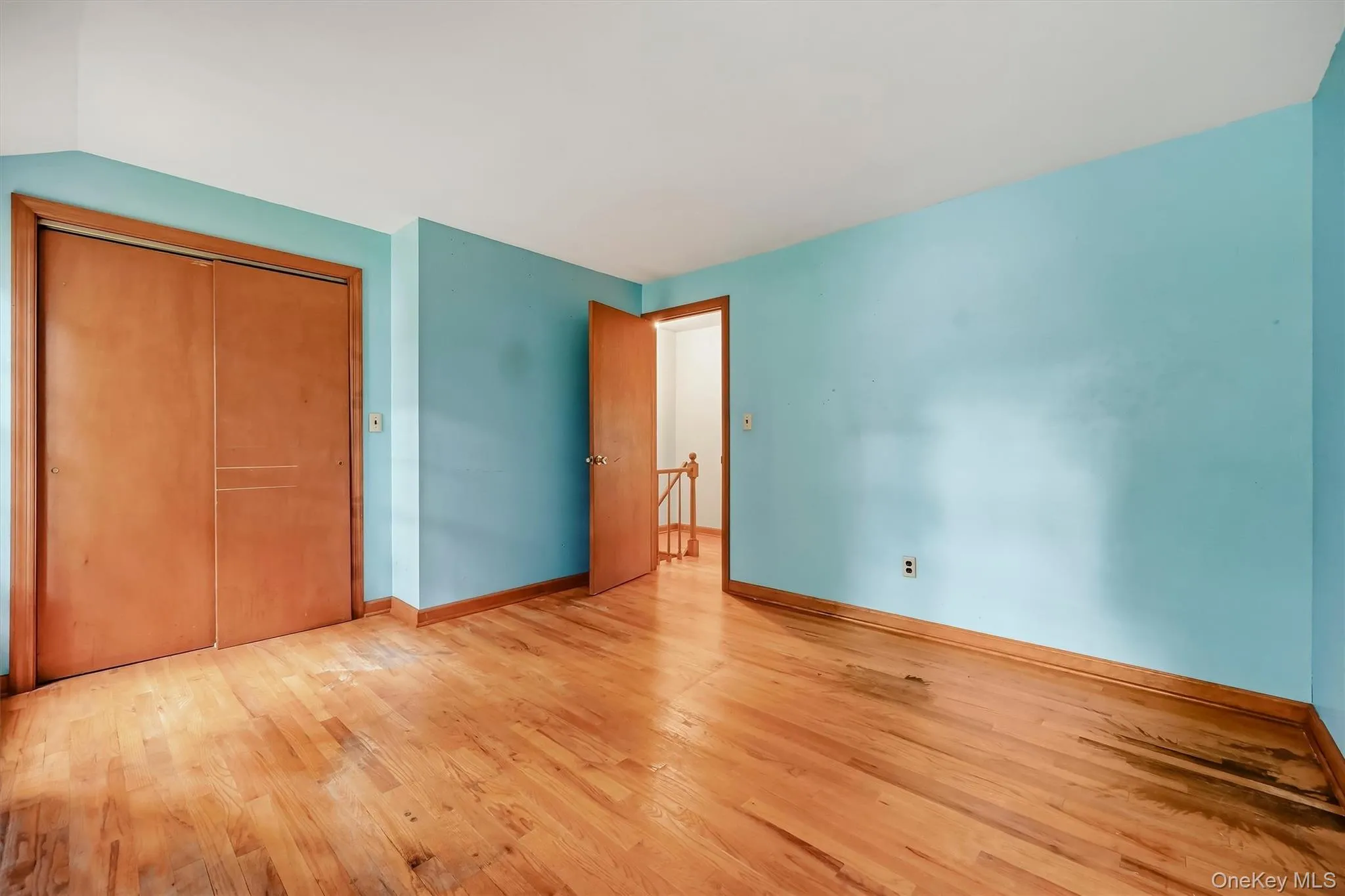 Wood-finish flooring with a satin finish, built-in closet with sliding doors, and a wood-finish trim package Wood-finish flooring with a satin finish, built-in closet with sliding doors, and a wood-finish trim package
