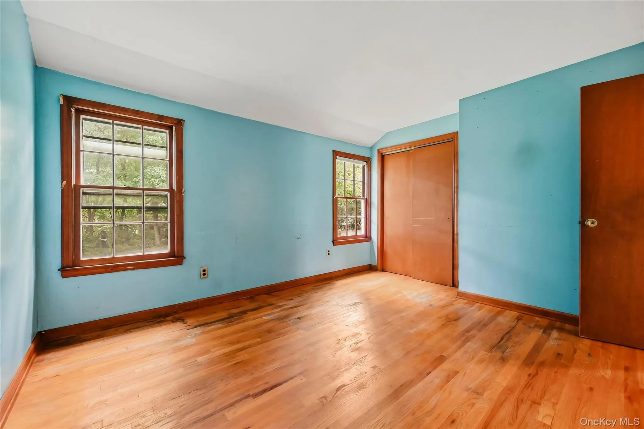 Hardwood flooring, two sash windows with wood trim, wood interior doors, closet Hardwood flooring, two sash windows with wood trim, wood interior doors, closet