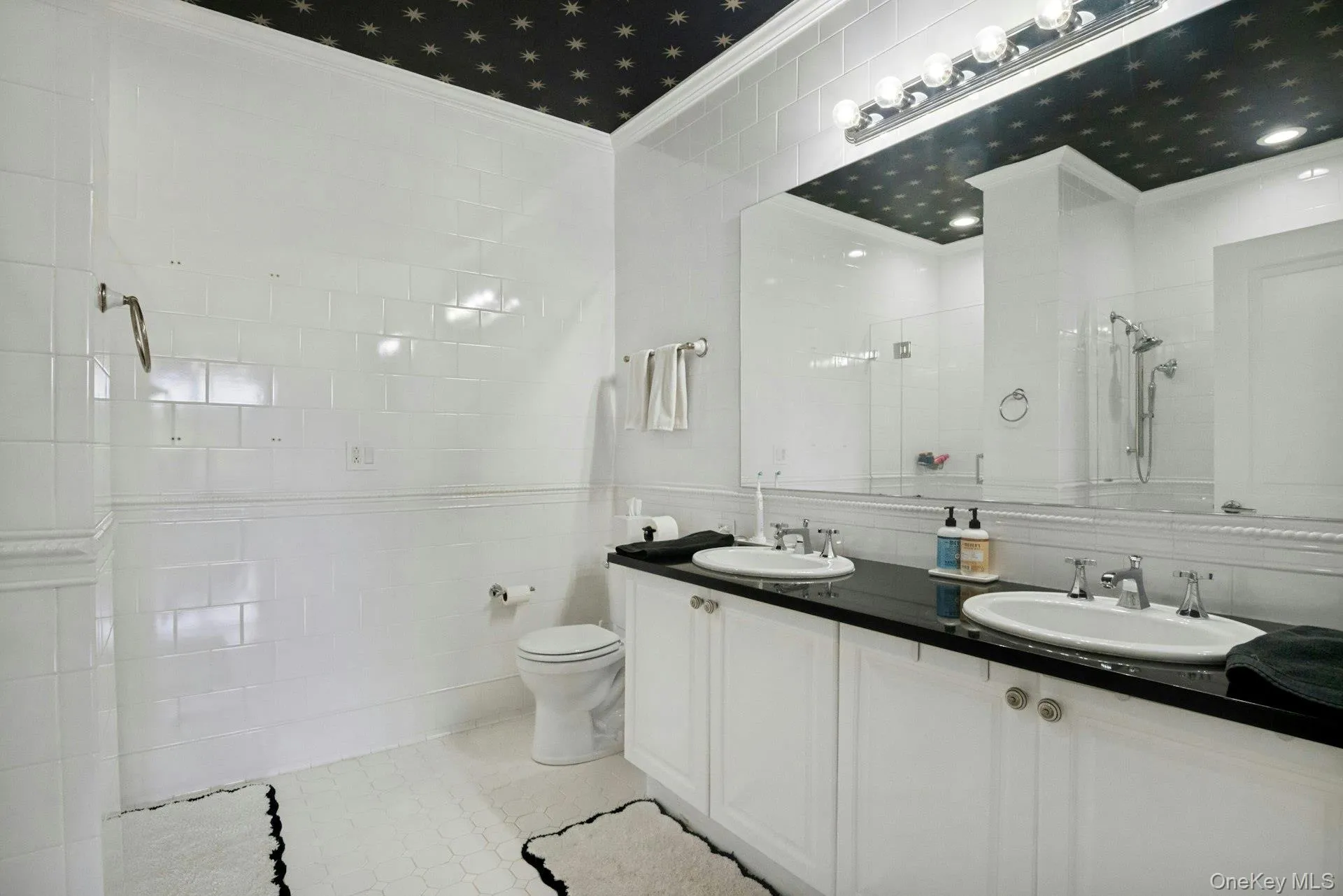 Large primary bathroom with double-sink vanity Large primary bathroom with double-sink vanity