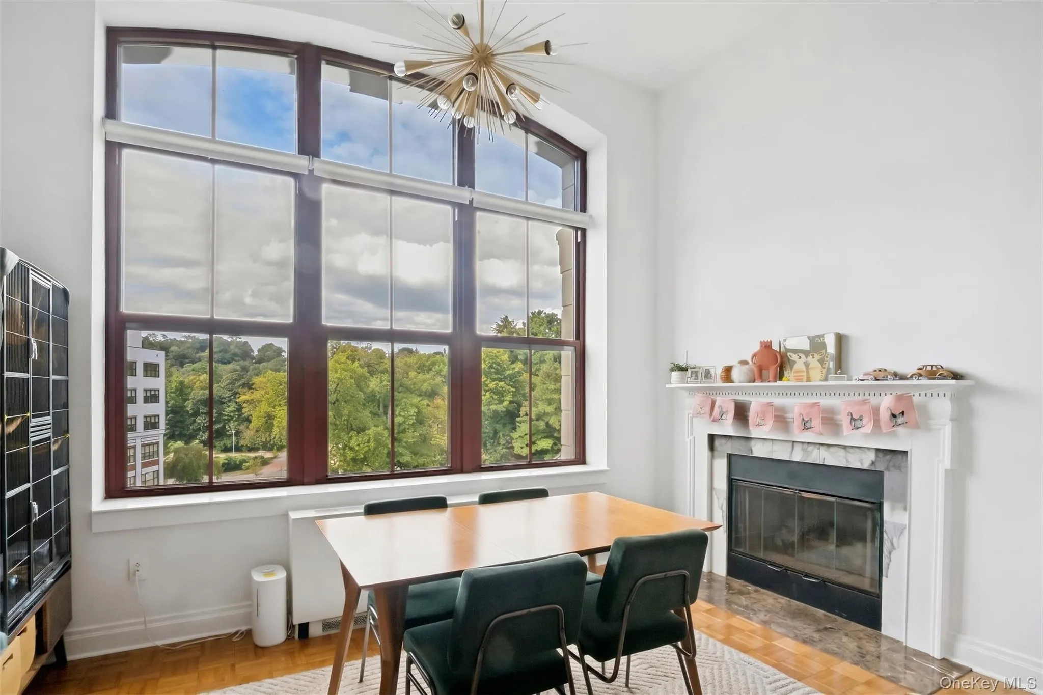 Dining area of the sprawling LR/DR with gas-fired fireplace Dining area of the sprawling LR/DR with gas-fired fireplace