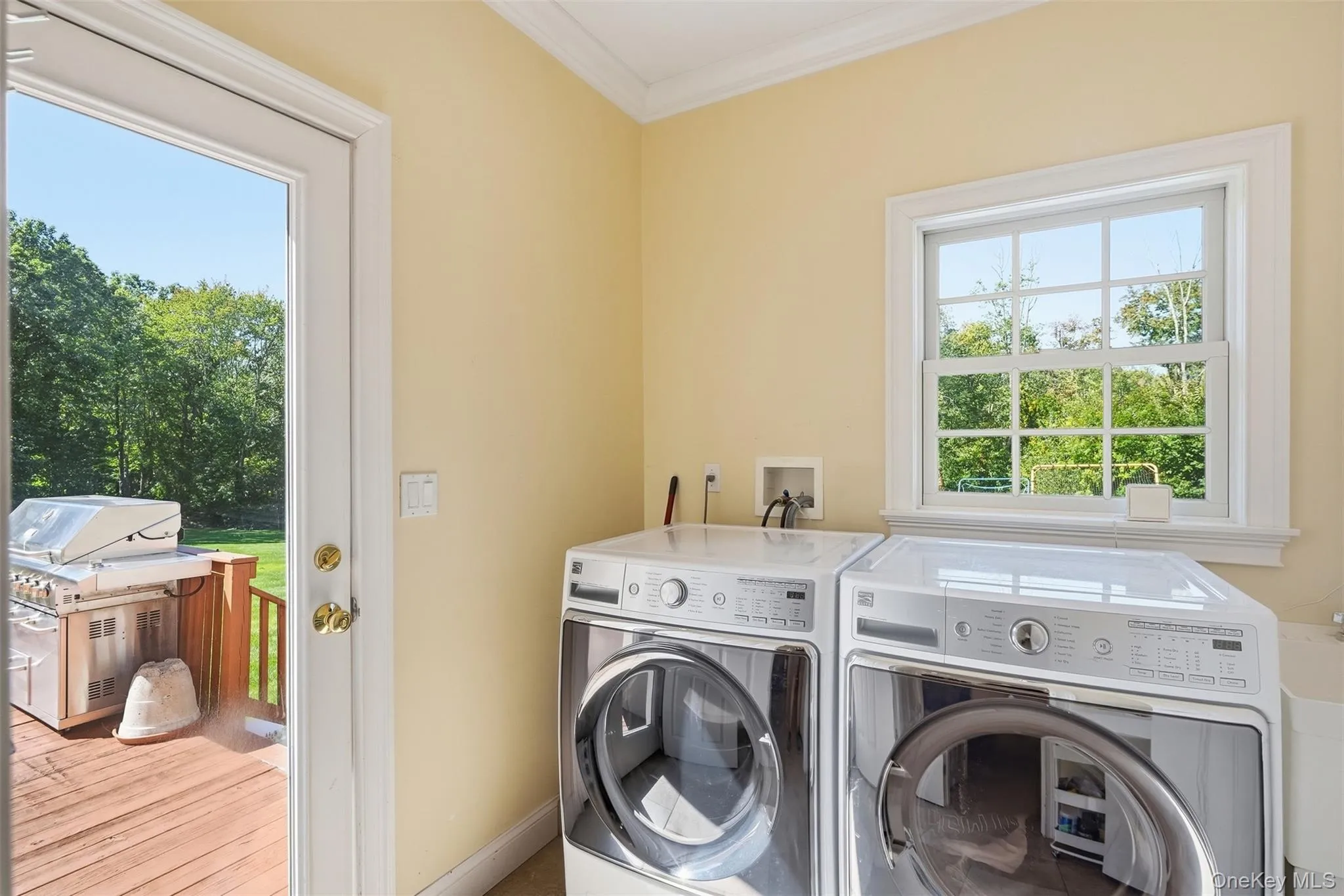 Laundry room with deck and garage access Laundry room with deck and garage access