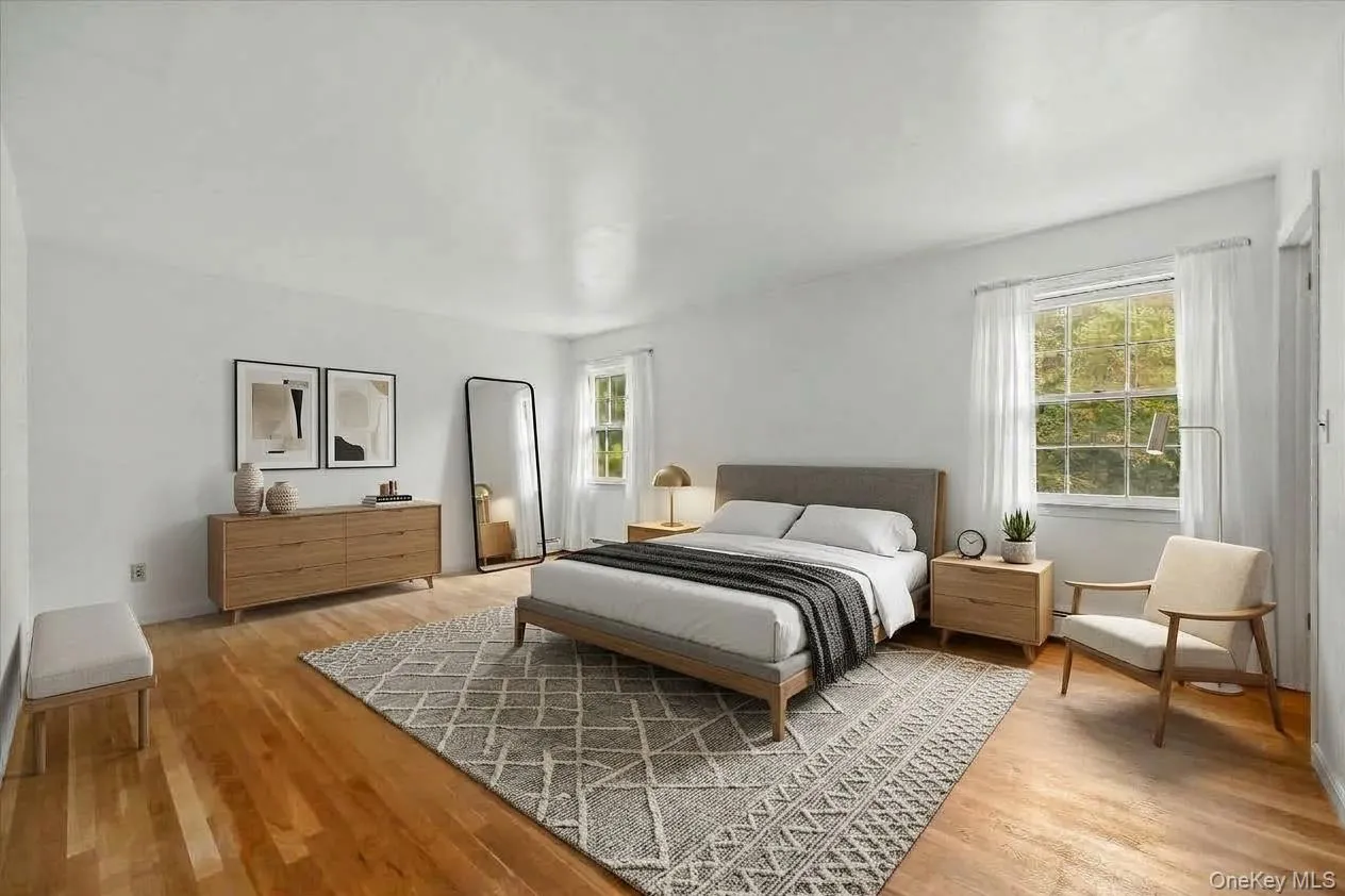 The primary en suite bedroom virtually staged. The primary en suite bedroom virtually staged.